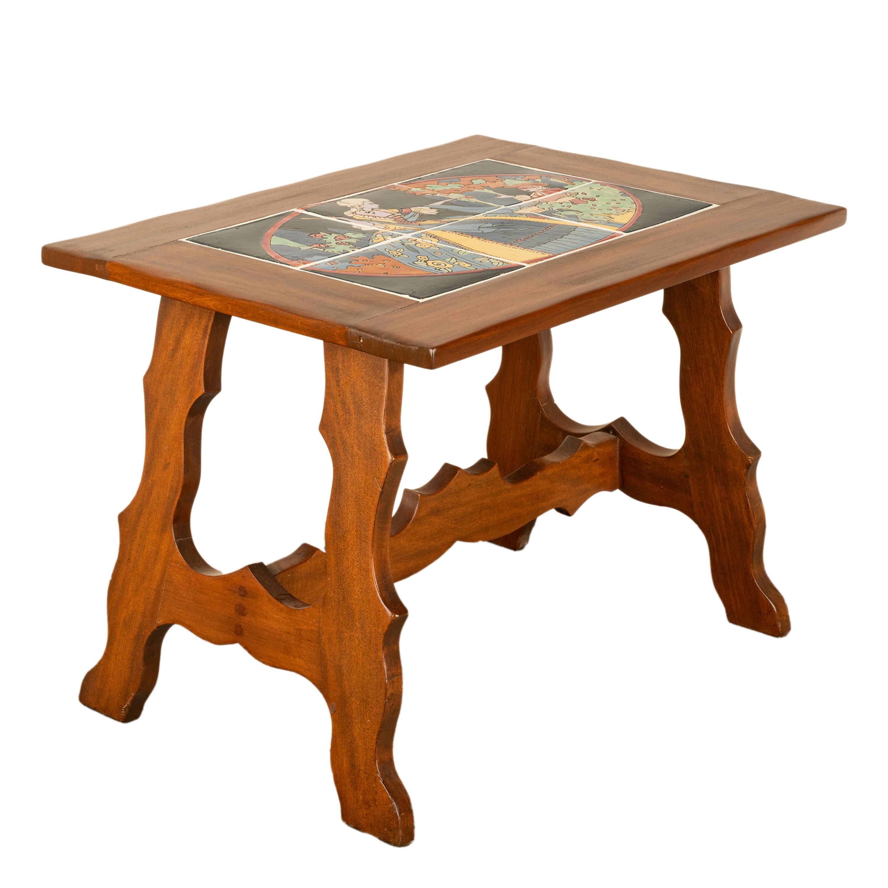 An unusual antique California Monterey Catalina tile topped walnut coffee/side table, circa 1930.
A wonderful walnut table inlaid with brightly glazed tiles from the Catalina Tile Company and dating to the late 1920s. The brightly glazed frieze of