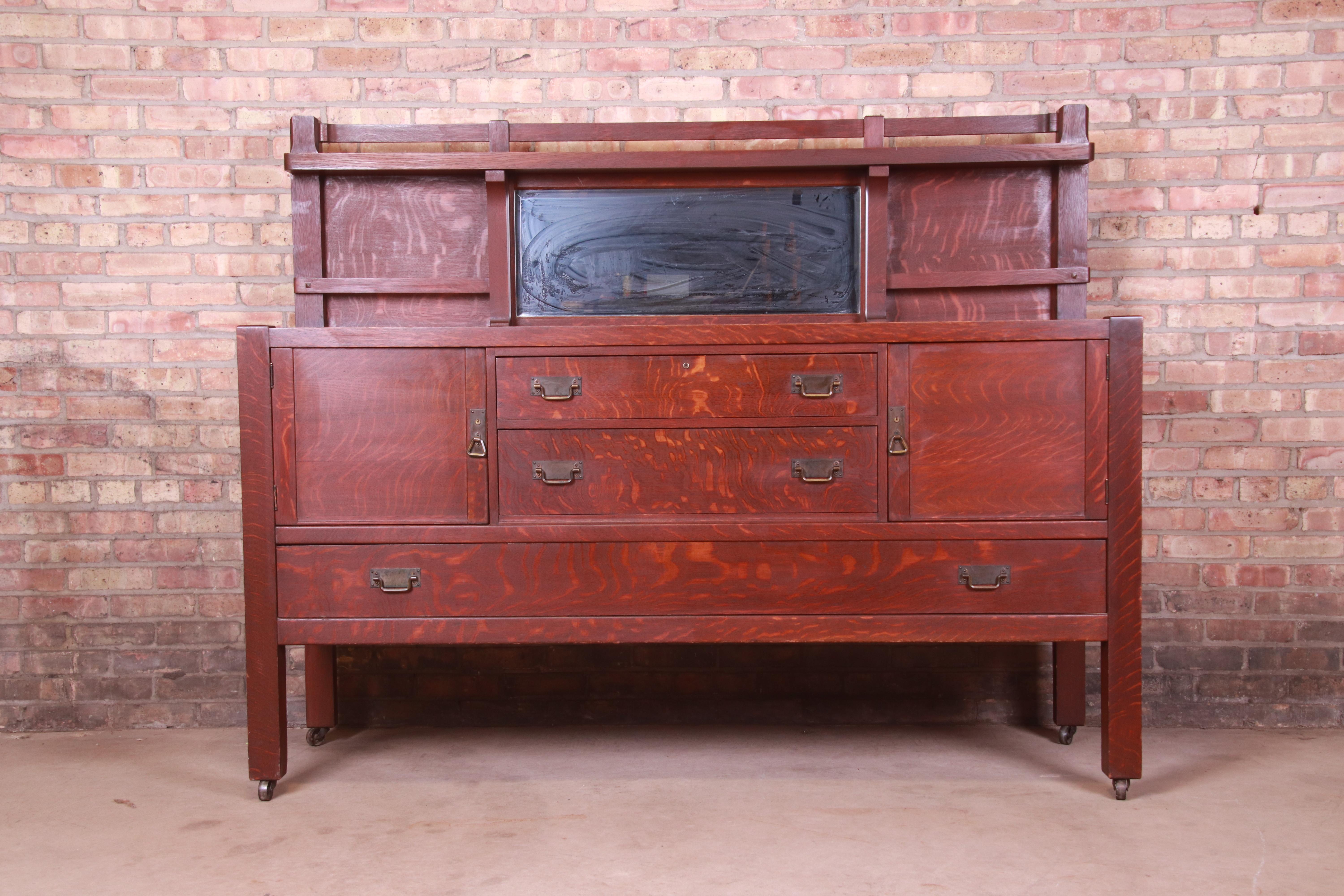 A gorgeous antique Mission oak Arts & Crafts sideboard, credenza, or bar cabinet

Attributed to Stickley Brothers

USA, Circa 1900

Quarter sawn oak, with original hammered copper hardware and mirrored backsplash.

Measures: 71.5