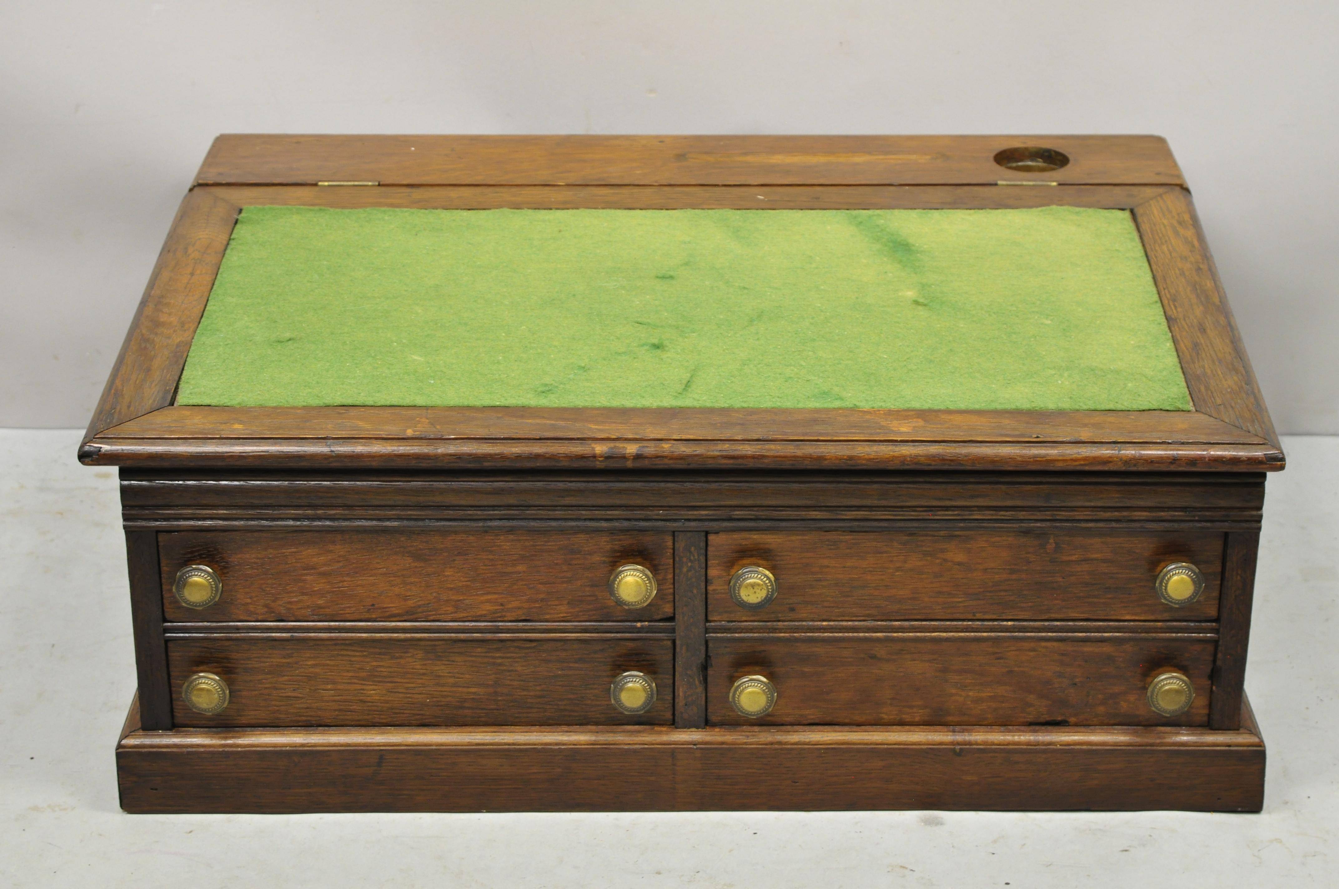 Antique Mission Oak Arts & Crafts 4 drawer spool thread cabinet writing lap desk. Item features 4 dovetailed drawers, green felt top, lift lid, beautiful wood grain, brass pulls, very nice antique item. Circa 19th Century. Measurements: 12