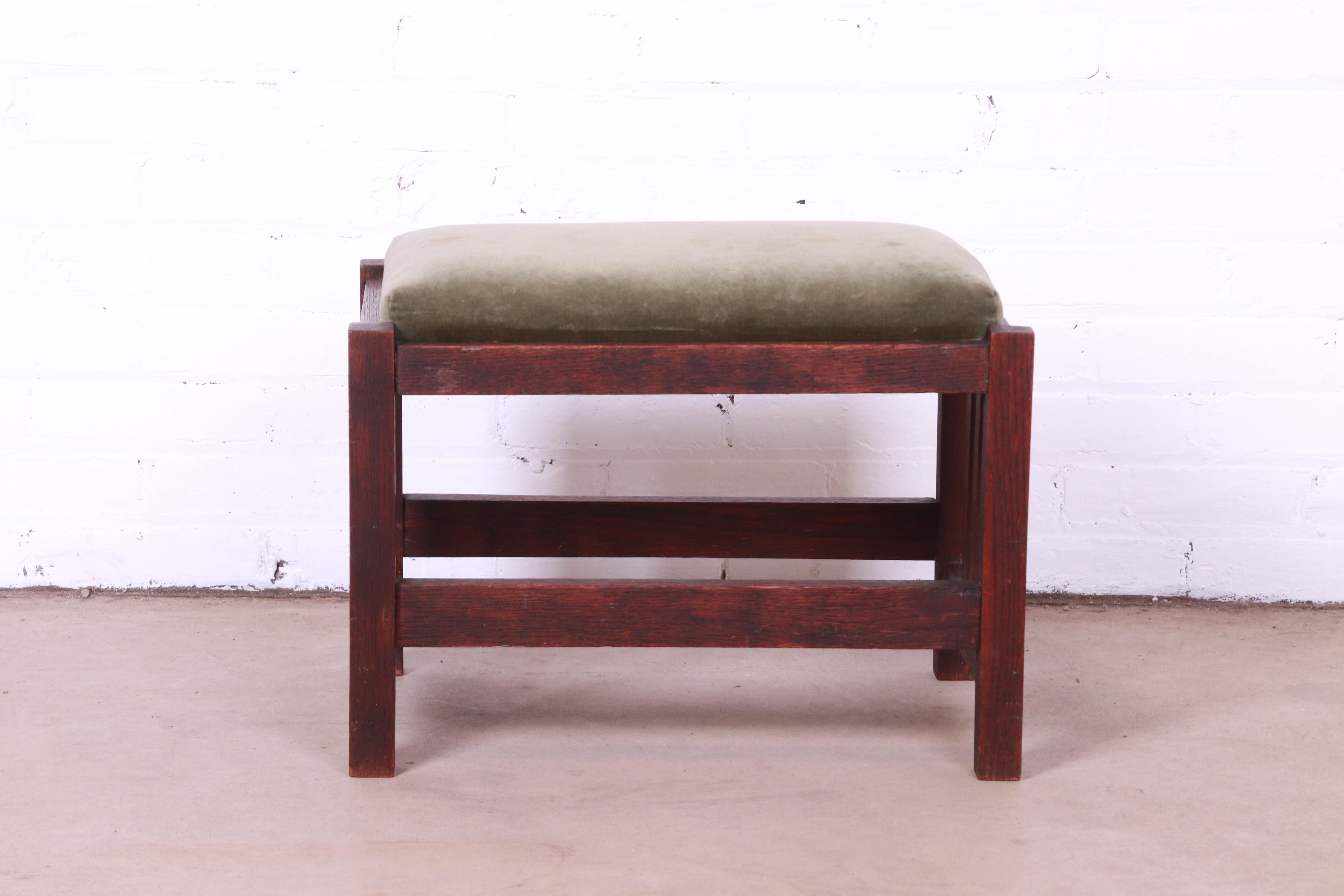 A gorgeous antique Mission Arts & Crafts period footstool or ottoman.

Recently procured from Frank Lloyd Wright's DeRhodes House.

Attributed to L. & J.G. Stickley

USA, Circa 1900

Solid oak, with green velvet upholstery.

Measures: