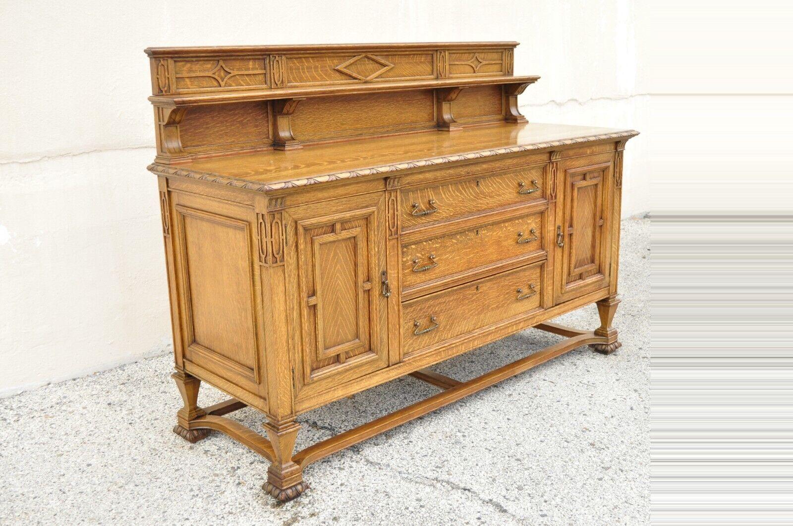 Antique Mission Oak Arts & Crafts Sideboard Buffet by Grand Rapids Furniture Co. Item features a carved backsplash with shelf, carved stretcher base, unique copper hardware, beautiful wood grain, 2 swing doors, original label, 3 dovetailed drawers,
