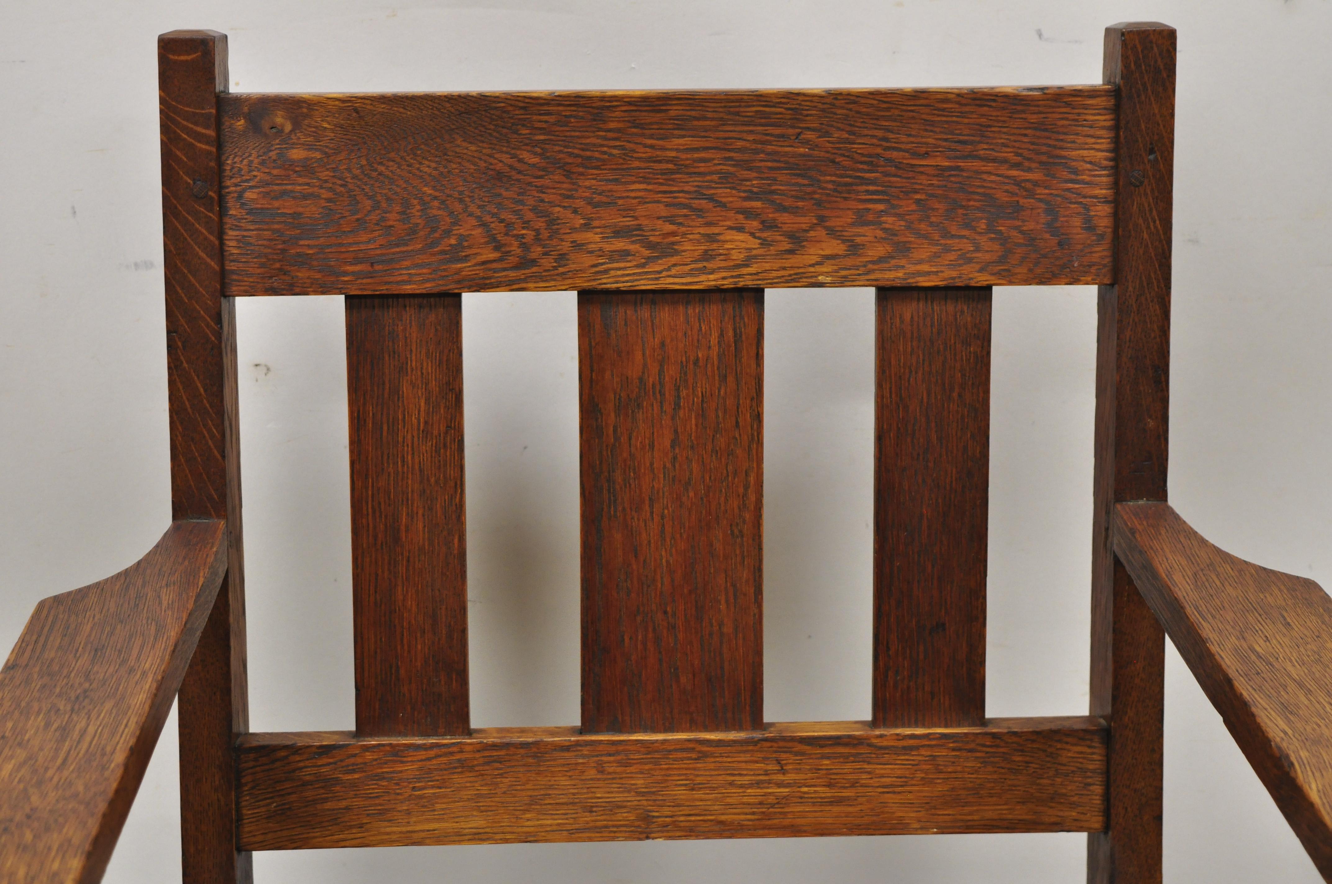Antique mission oak Arts & Crafts Stickley style arm chair. Item features solid wood construction, beautiful wood grain, very nice antique item, quality American craftsmanship. Circa Early 1900s. Measurements: 37