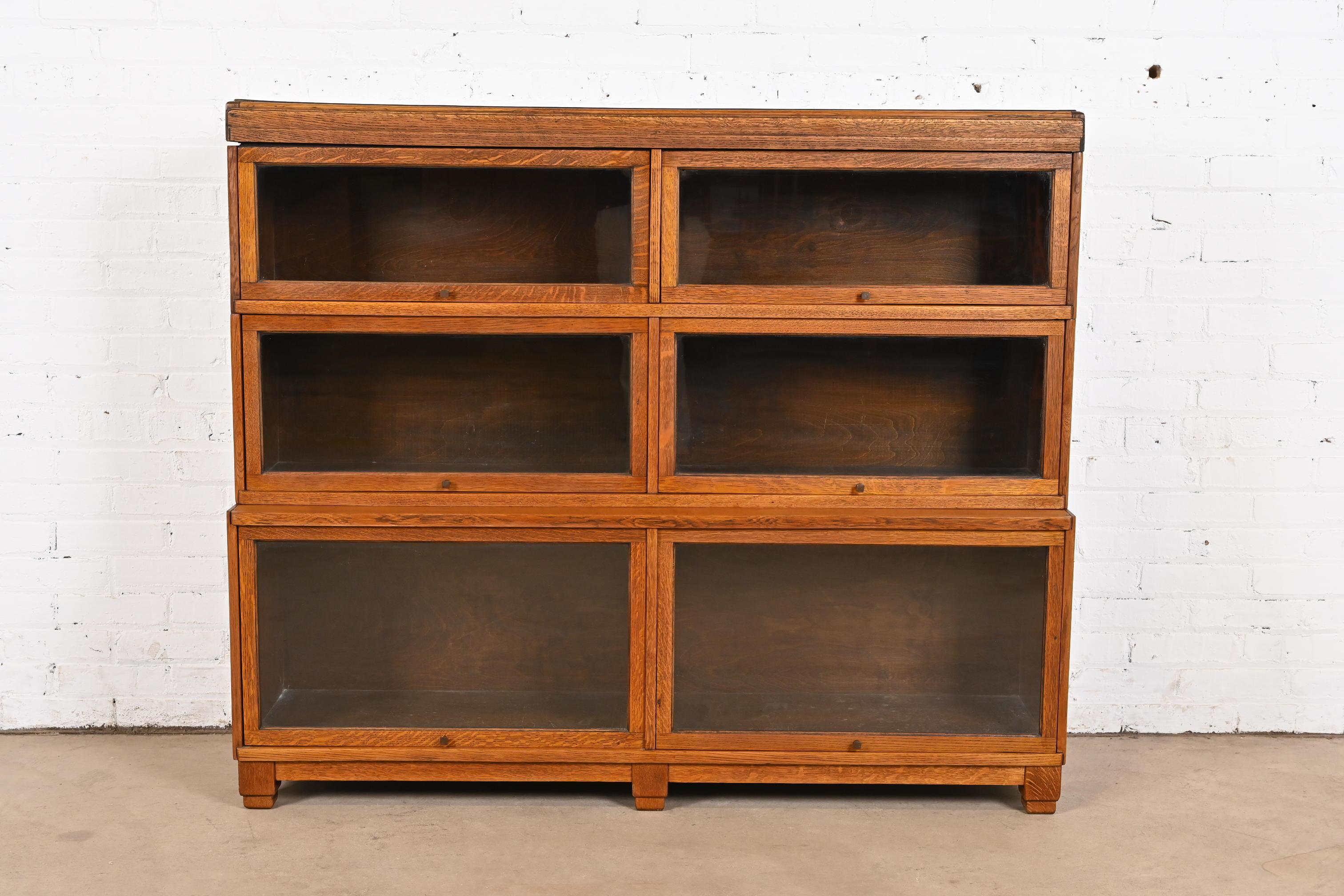A gorgeous antique Mission or Arts & Crafts three-stack double barrister bookcase

Attributed to Globe Wernicke

USA, Circa 1920s

Beautiful quarter sawn oak, with glass front doors, and original brass hardware.

Measures: 54