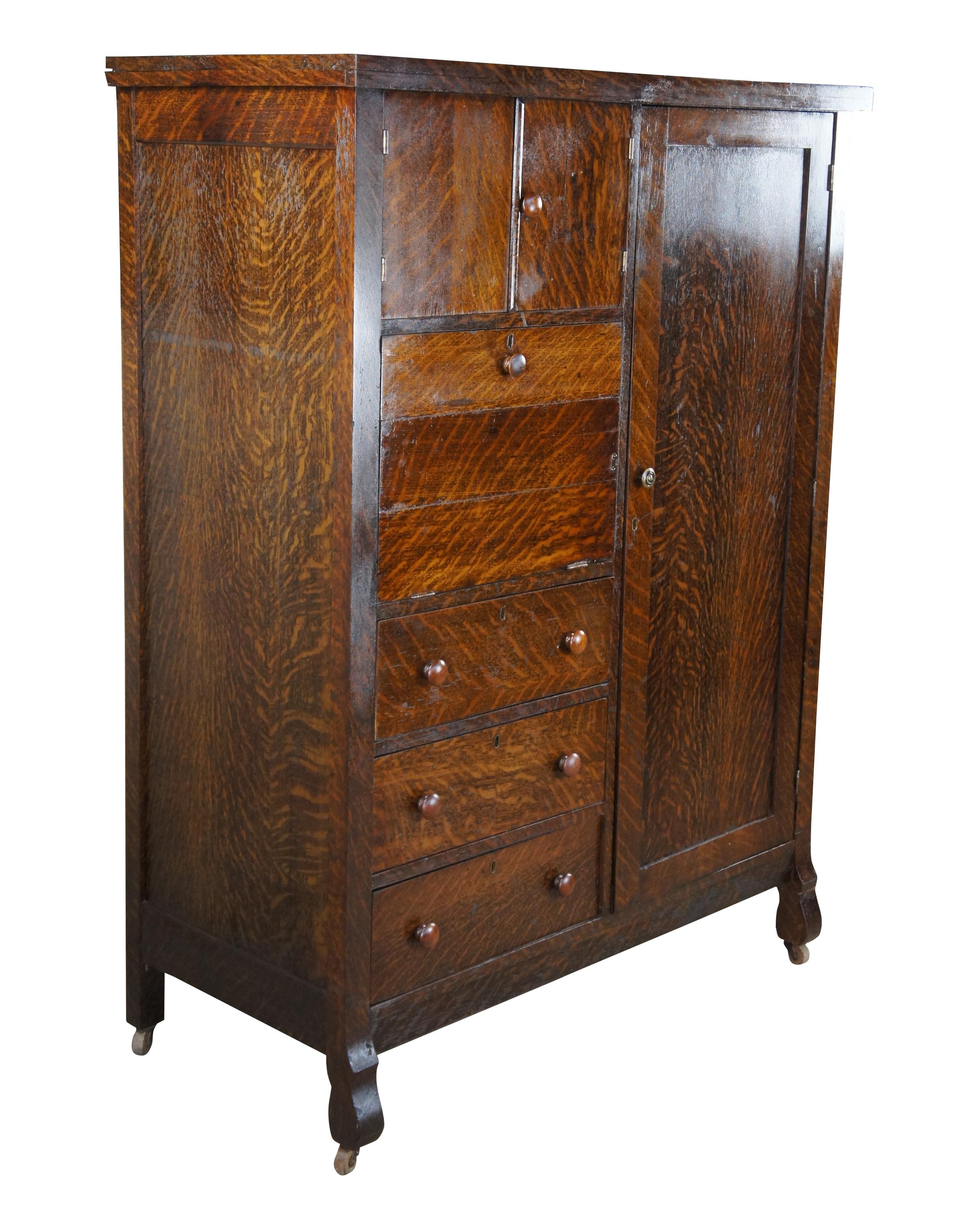 Antique multi function chifferobe armoire / secretary writing desk / dresser cabinet.  Made of quartersawn oak featuring hanging armoire, sloped secretary writing desk with cubbies / letter slots and drawer, upper cabinet and three lower dresser