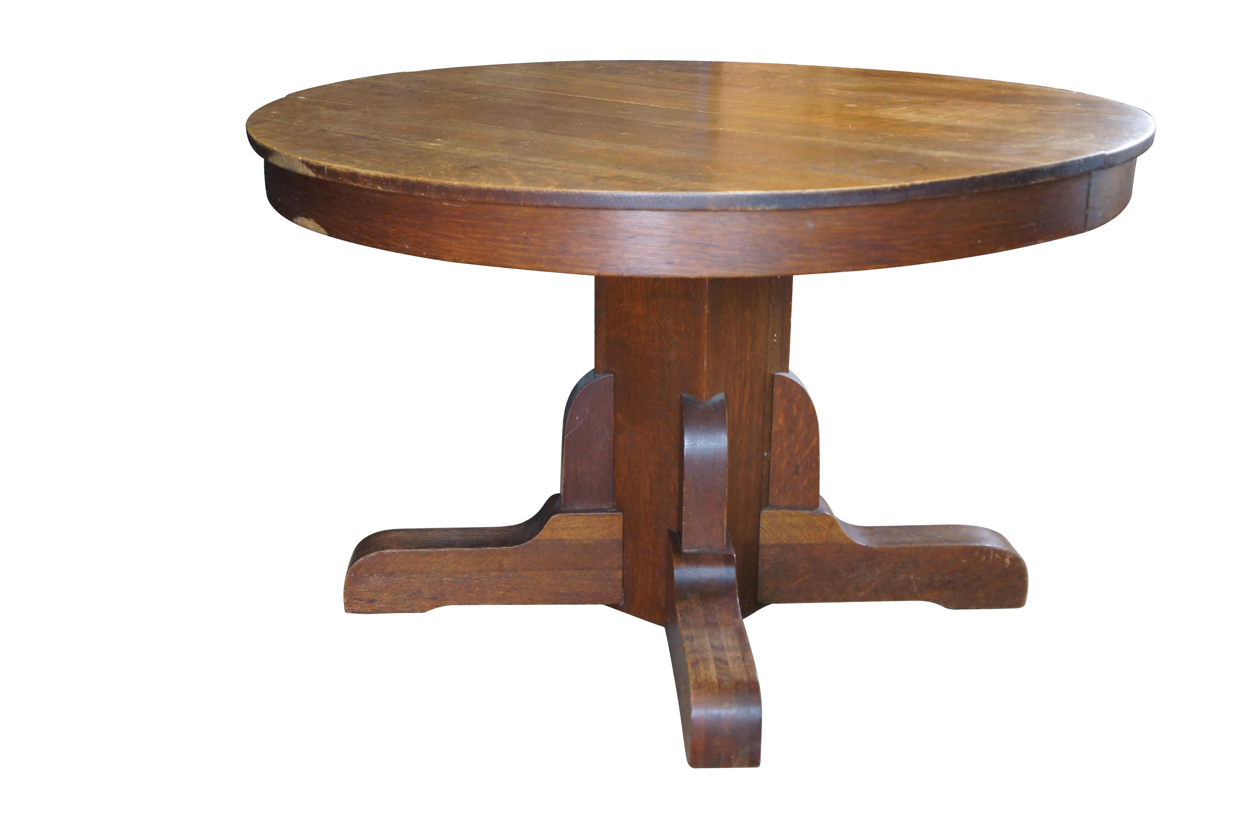Antique Mission style round dining or breakfast table featuring square pedestal base with castors.

Dimensions:
48 x 48