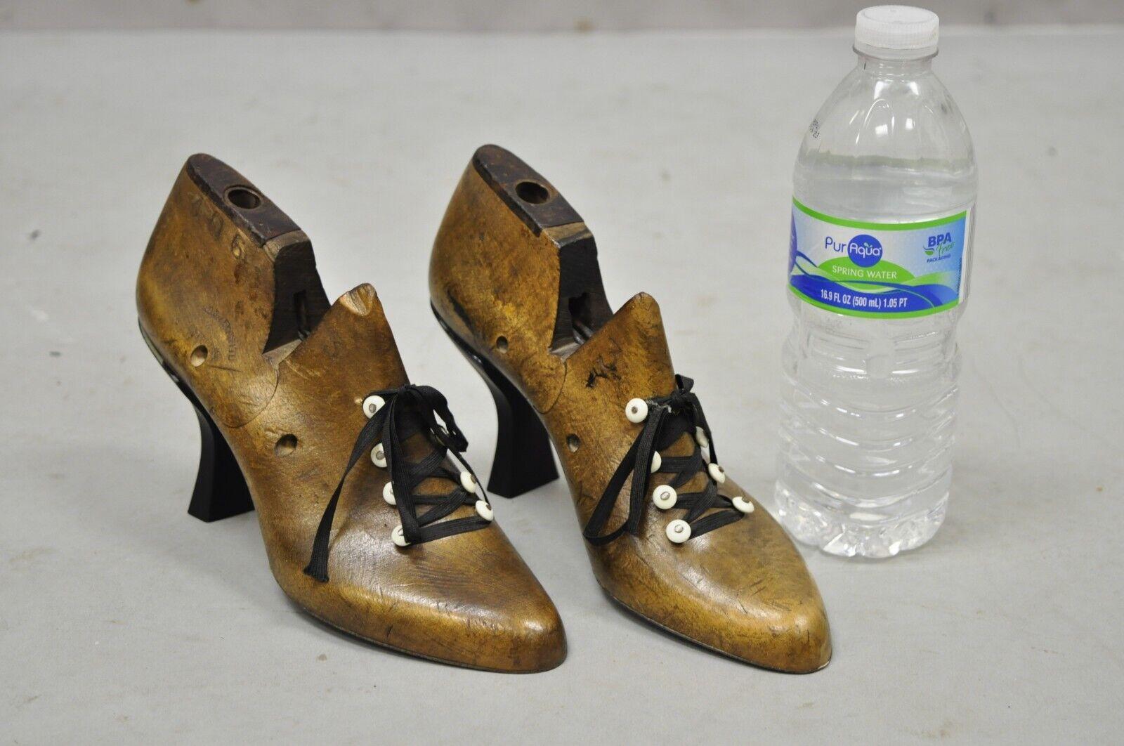 Antique Mobbs & Lewis Ltd Wooden English shoe lasts women's heel - a Pair. Item features original antique wooden shoe lasts, repurposed form with heels and laces, very nice antique pair. Circa 19th Century. Measurements: 5.5