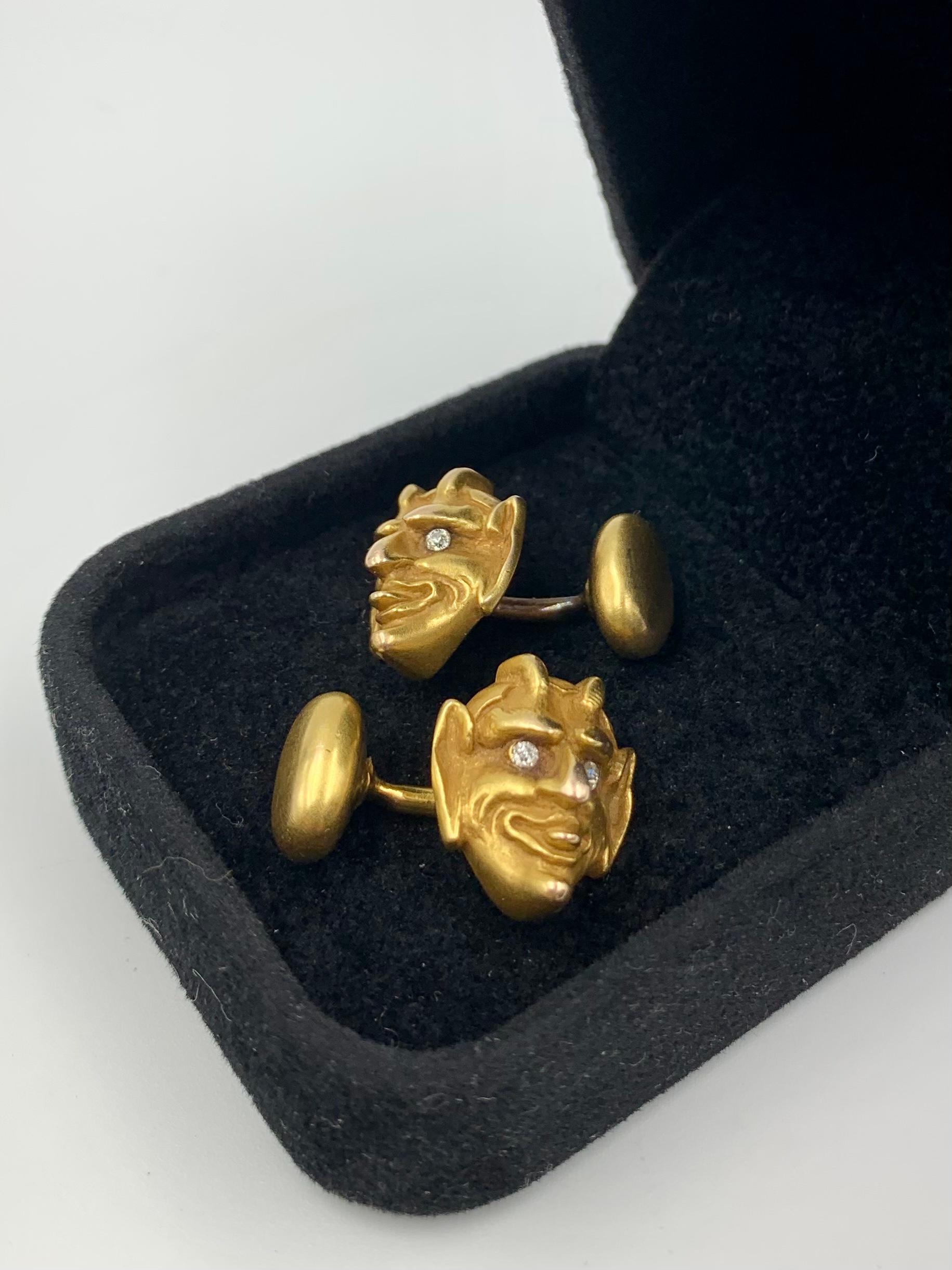 Victorian Period Diamond, 14K yellow gold Mocking Tongue Devil cufflinks
Late 19th Century
Charming, mischevious Diamond Eyed Lucifer naturalistically portrayed sticking his tongue out in a mocking gesture. The gesture traces its history back to