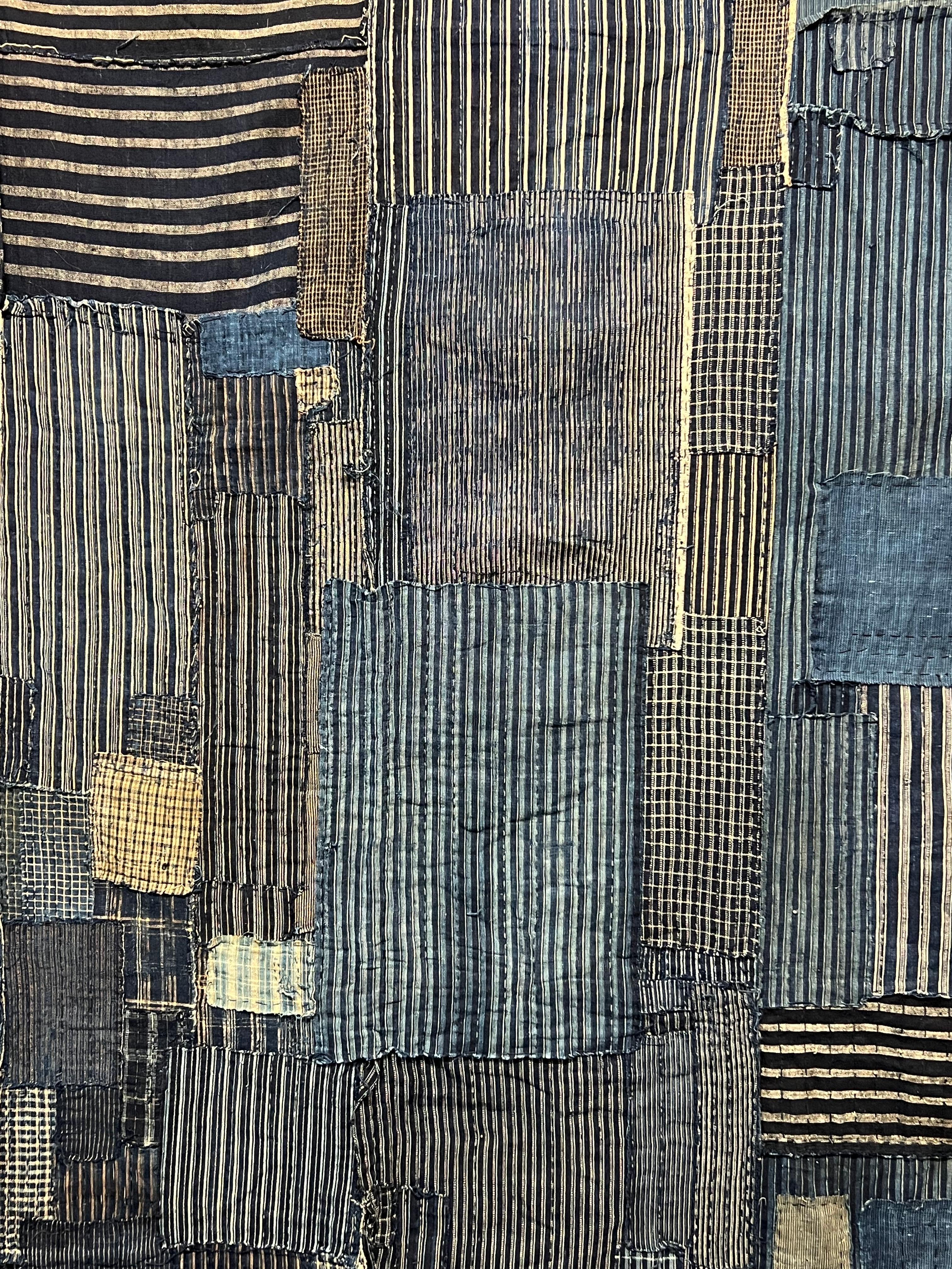 Incredible vintage Japanese indigo fabric Boro wall hanging c1900s. Acquired in Kyoto from a reputable textile dealer. Amazing detail and craftsmanship, has a wonderful weight and softness. No odors or mildew, this was stored properly. Bamboo rod