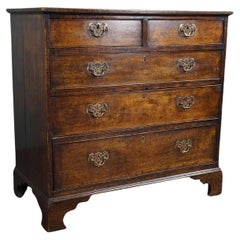 Antique modest oak English chest of drawers, 18th century