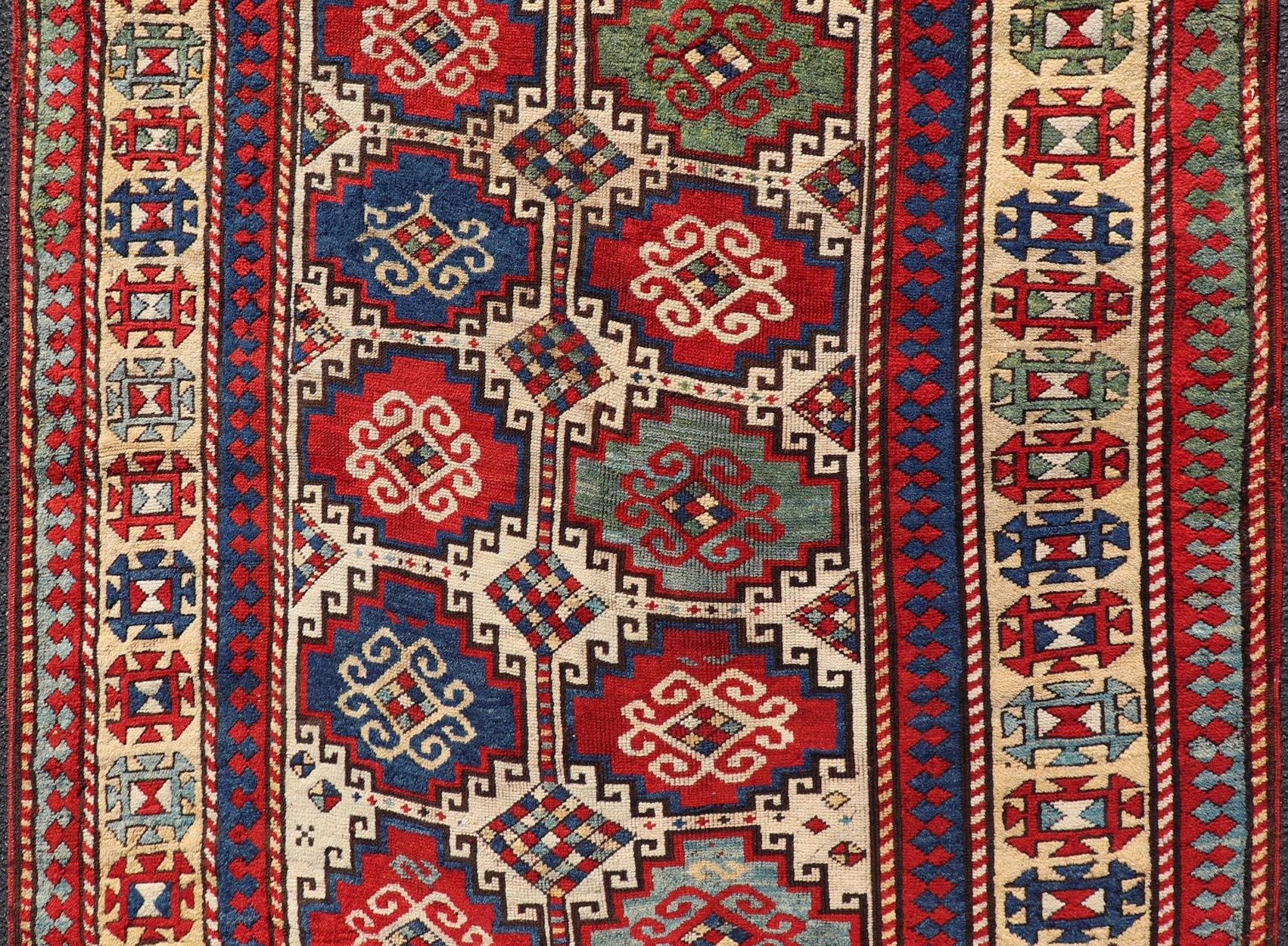 Antique Moghan Kazak Rug Showcasing Bold Geometric Medallions 4'6 x 6' In Excellent Condition For Sale In Atlanta, GA