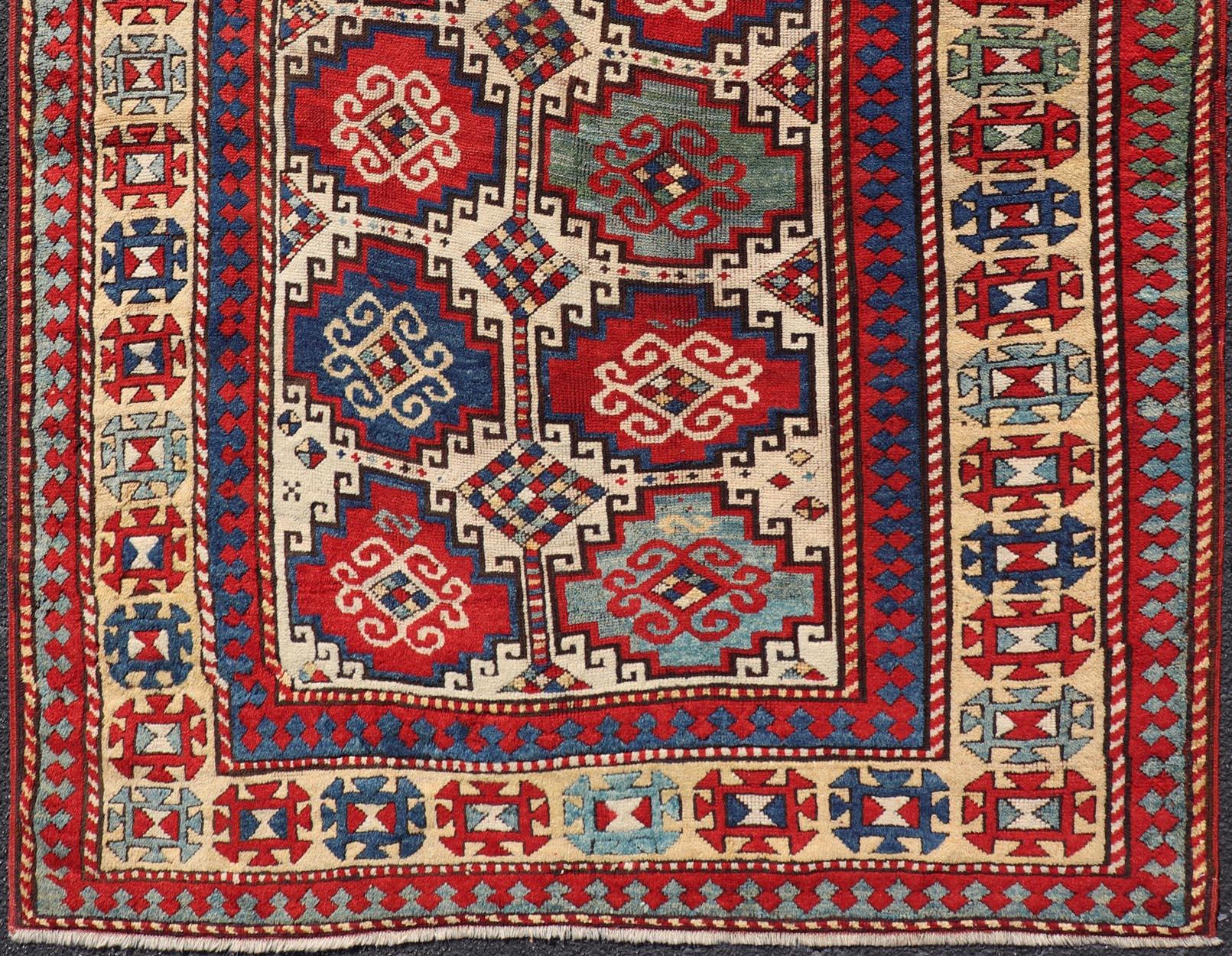 19th Century Antique Moghan Kazak Rug Showcasing Bold Geometric Medallions 4'6 x 6' For Sale