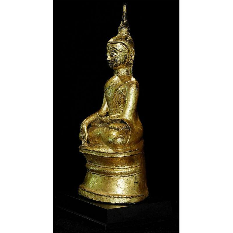Material: bronze
60,5 cm high 
The height of just the bronze (without the wooden base) is 55 cm
Weight: 20.8 kgs
Gilded with 24 krt. gold
Mon style
Bhumisparsha mudra
Originating from Burma
17-18th century
A very special piece because of