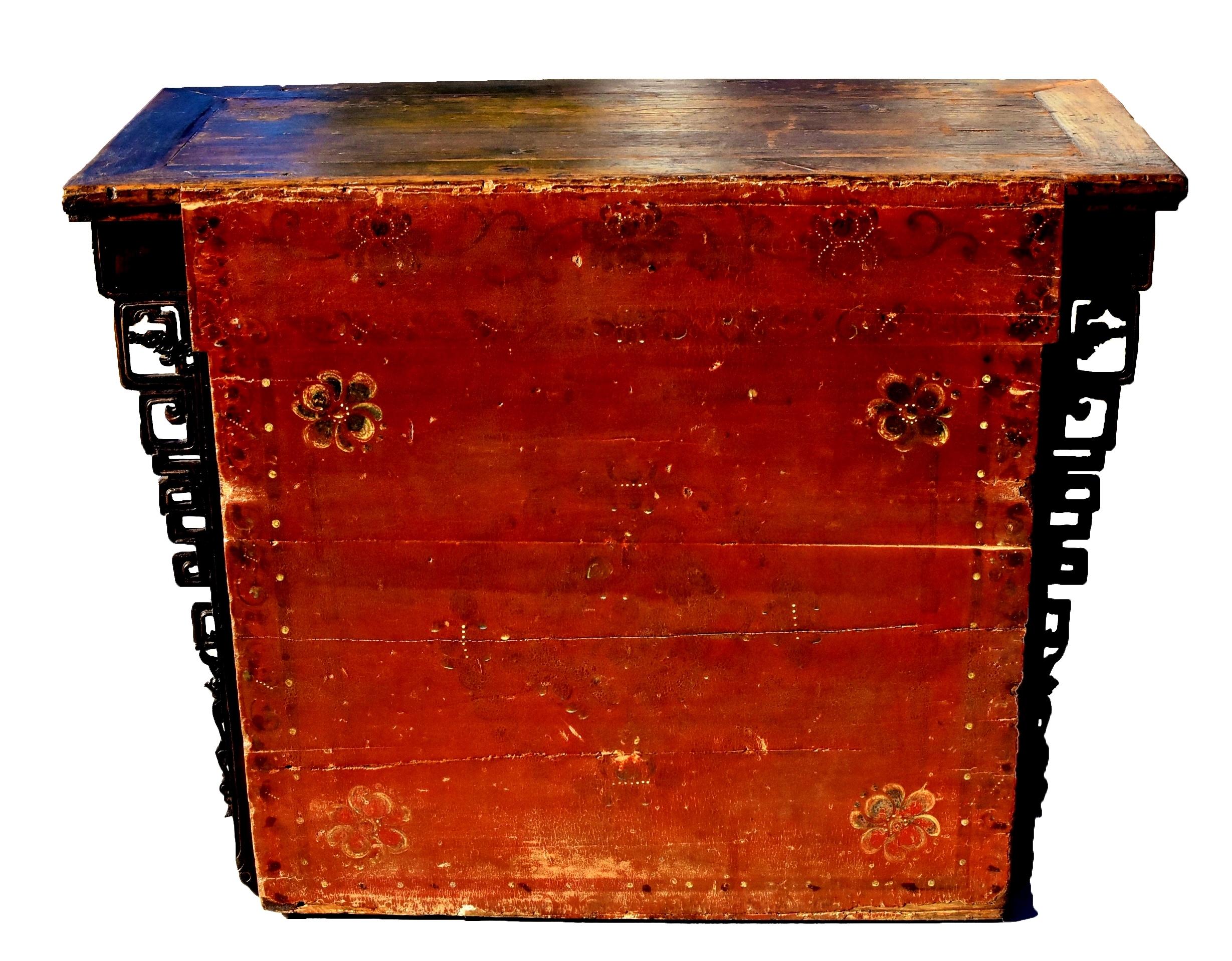 A beautiful, 19th century chest from Inner Mongolia. The top is of miter, tenon and mortise construction encasing a single board floating panel. Full apron depicts traditional Mongolian motifs of blossoms in circular form, hand painted in gorgeous