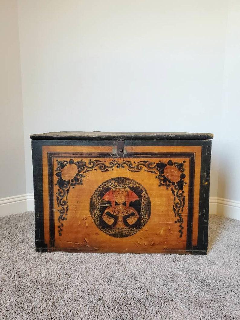 Scarce Mongolian hand carved and painted wooden chest from the 19th century. 

A magnificent Asian antique whose patina is well preserved. Presenting in vibrant original colors, elegantly aged, weathered and distressed, chippy paint crackled
