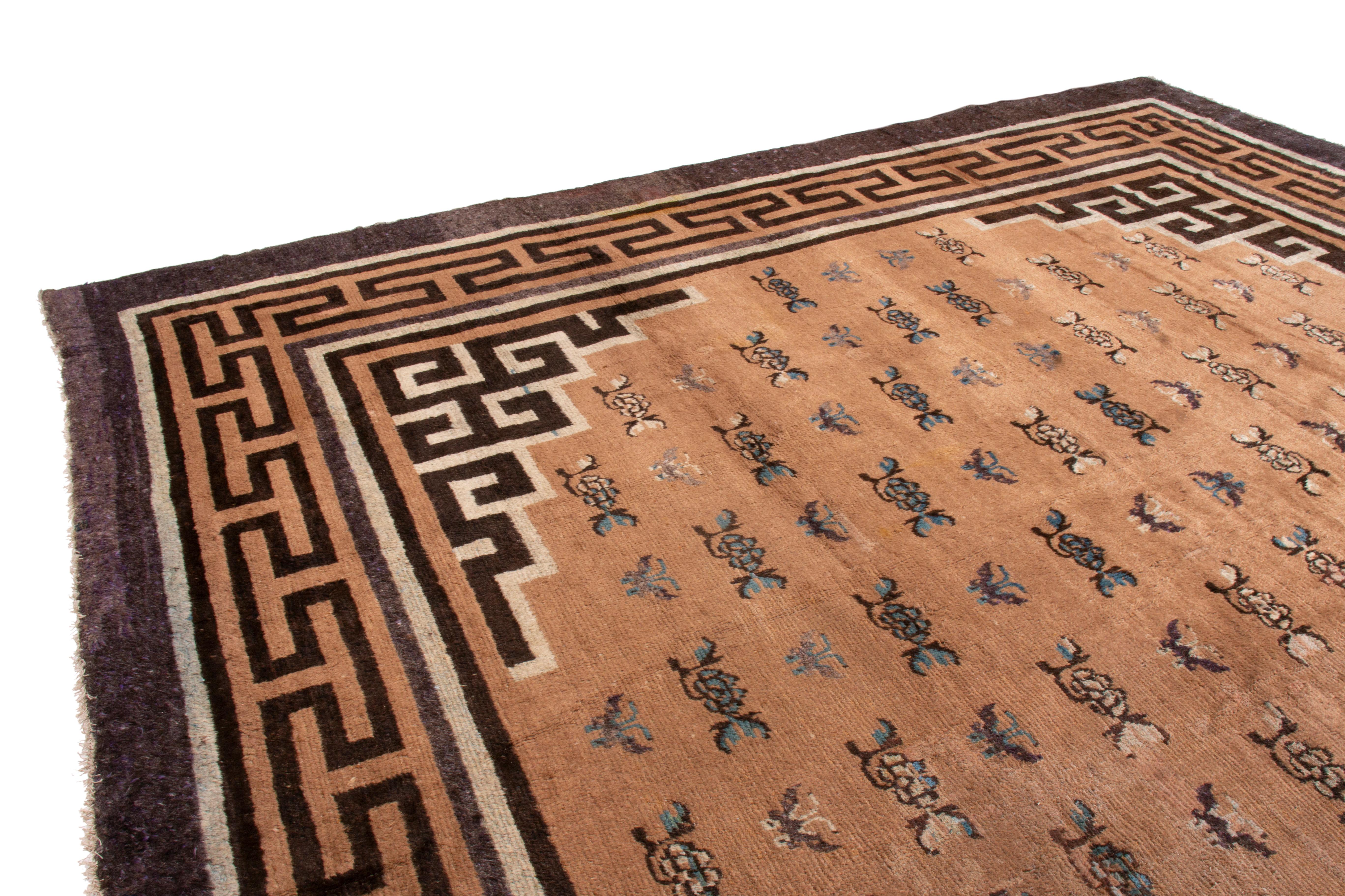This antique transitional Mongolian wool rug has an all-over floral design with unique Chinese inspiration. From 1860-1870, the inner border features black right-angle characters-archaic Chinese symbols commonly seen in other oriental and Turkish