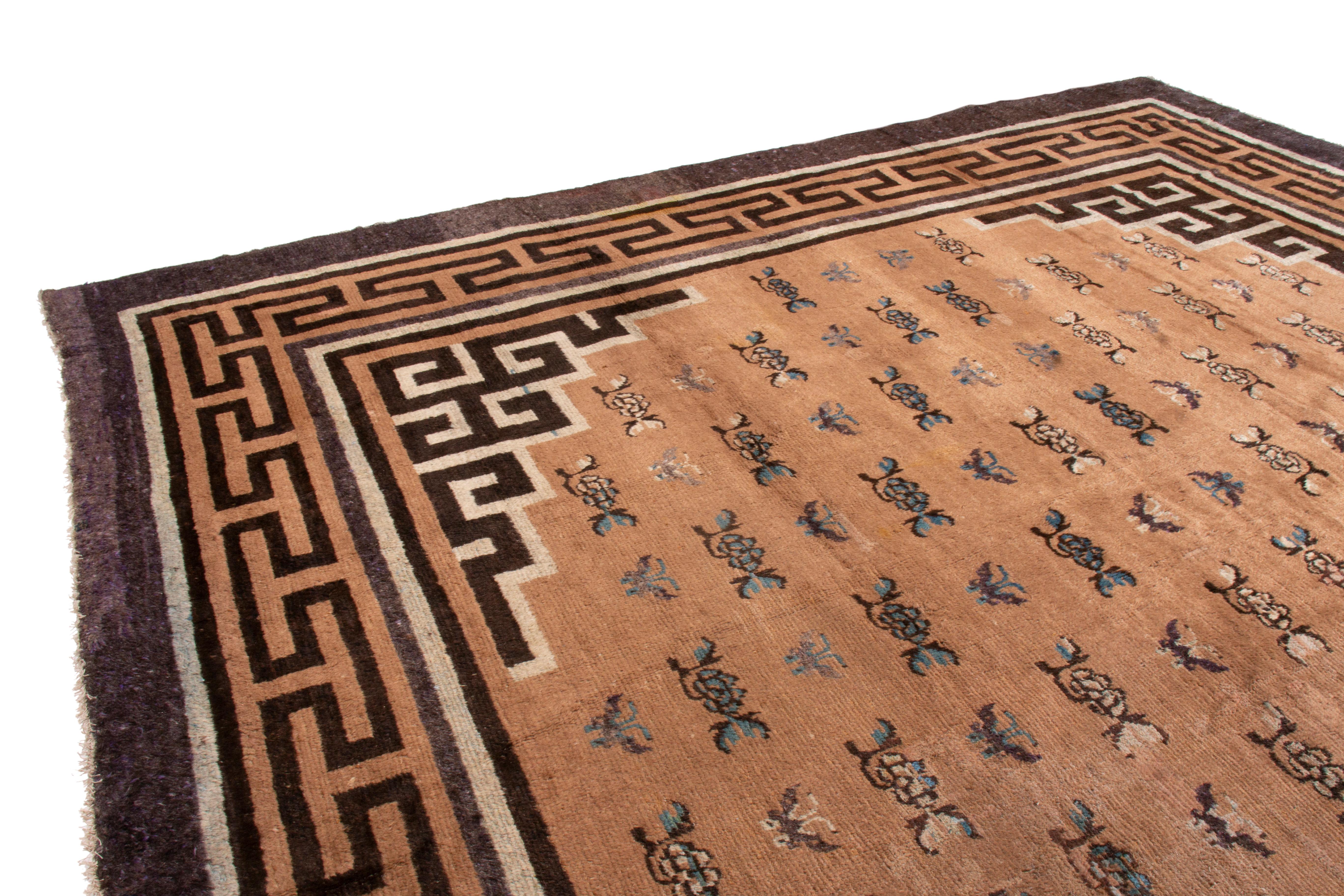Hand-knotted in wool circa 1860-1870, this 12×17 antique Mongolian rug features traditional designs and geometric borders, in brown, silver and black hues. 

On the Design: 

Admirers of craft may note that Mongolian rugs like this masterpiece are