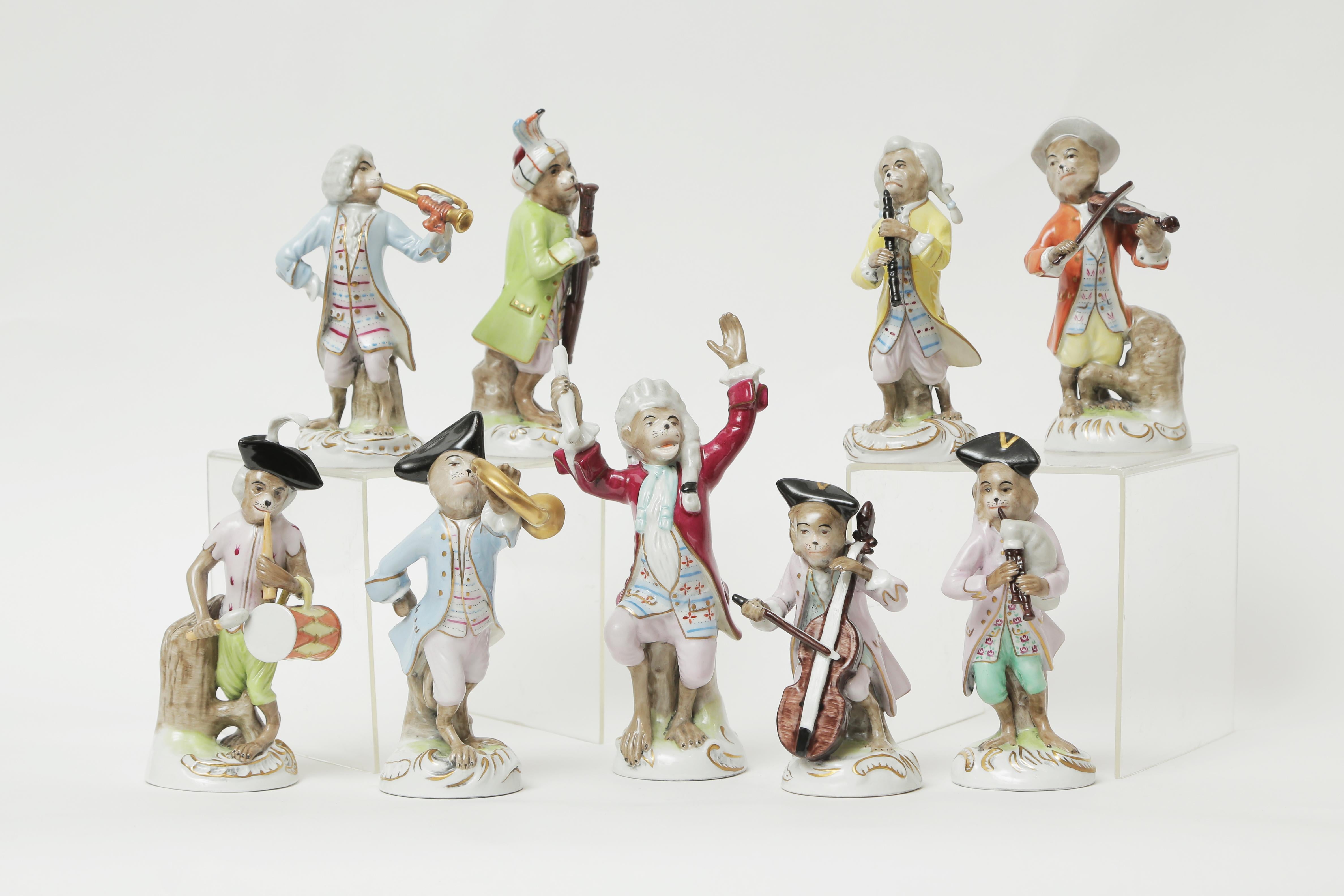 A charming and whimsical grouping of fine antique porcelain figurines by Dresden. We have the main conductor orchestrating his fellow bandmates in merriment. The colors have remained vibrant and crisp with very fine detailing to the molding of the