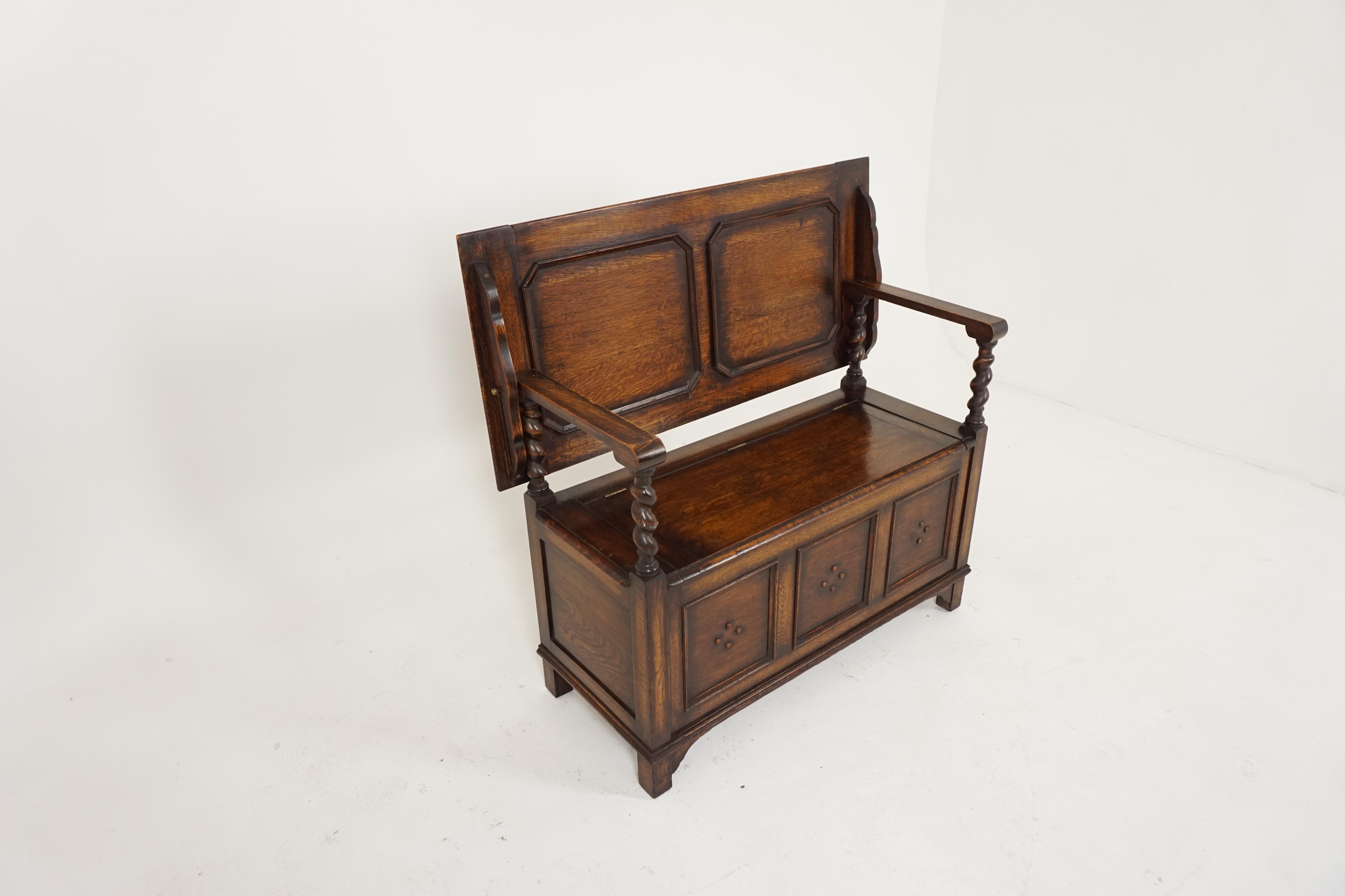 Antique monks bench, carved oak hall seat or settle bench, antique furniture, Scotland 1910, B1848

Scotland, 1910
Solid oak construction
Original finish
Paneled oak back with solid oak arm rests with barley twist supports
The seat lifts for