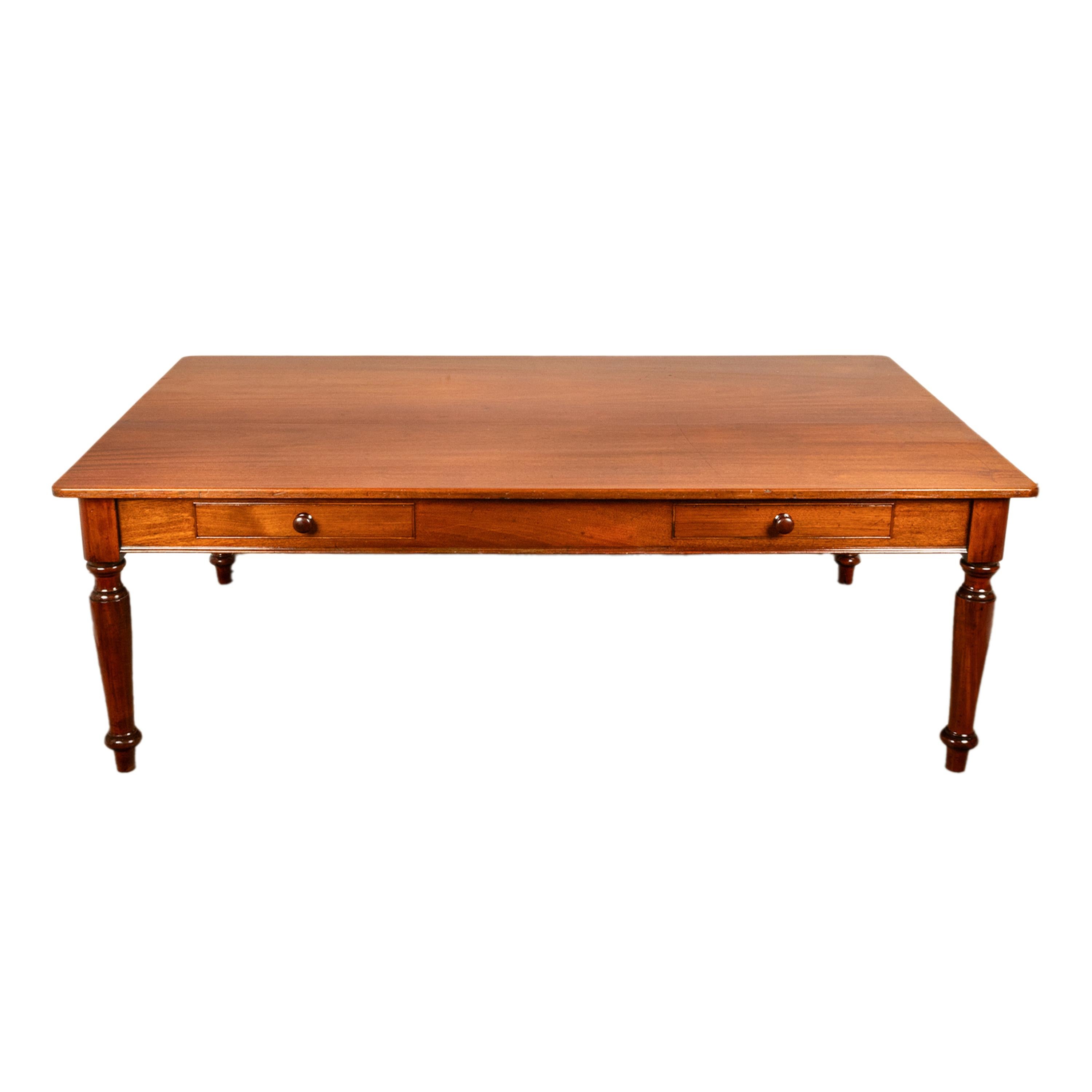 A large & fine quality solid flame mahogany library, conference or dinning table, circa 1860.
The table is made from the finest solid flame mahogany, the substantial top over two long drawers to the front, each fitted with a bun shaped handle. The