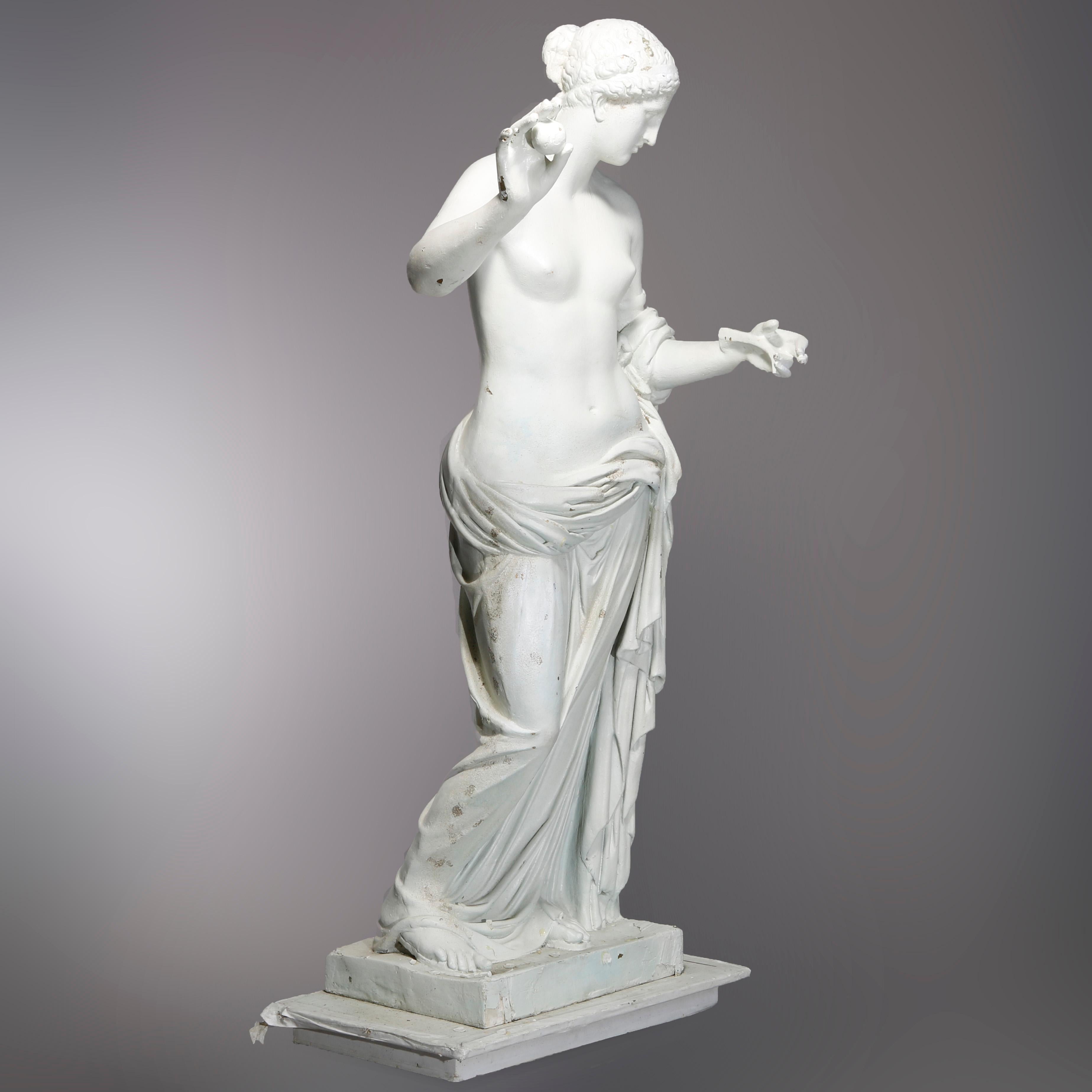 An antique monumental composite resin sculpture depicts the Classical Venus of Arles with apple as displayed at Musee du Louvre, Paris, France, Circa 1920

Measures: 84