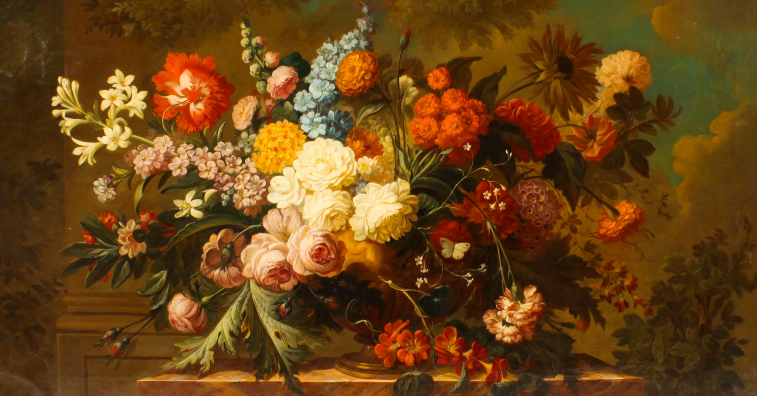 This is a magnificent monumental antique French school still life oil on canvas painting of a bouquet of flowers on a marble ledge, circa 1870 in date.

The large collection of brightly coloured summer flowers are arranged in a classical urn with a
