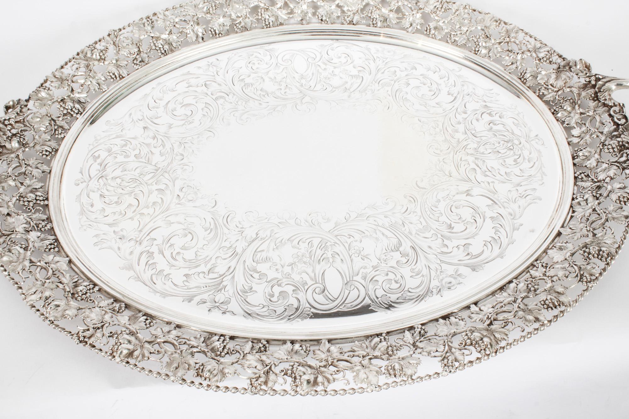 This is a momumental beautiful antique English Victorian oval silver-plated twin handled tray, circa 1870 in date.
 
This large oval silver plated tray features a pair of handles decorated with acanthus leaves. The tray has elegant engraved