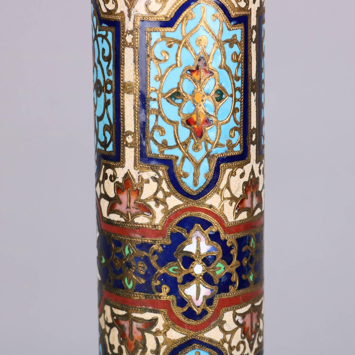 Antique Bradley & Hubbard parlor lamp features mosaic scroll and foliate Champleve enameled column, cast font and foot is pierced with scroll and foliate decoration, reminiscent of mosaic oil lamp, globe is frosted, circa 1890.

Measures: 34
