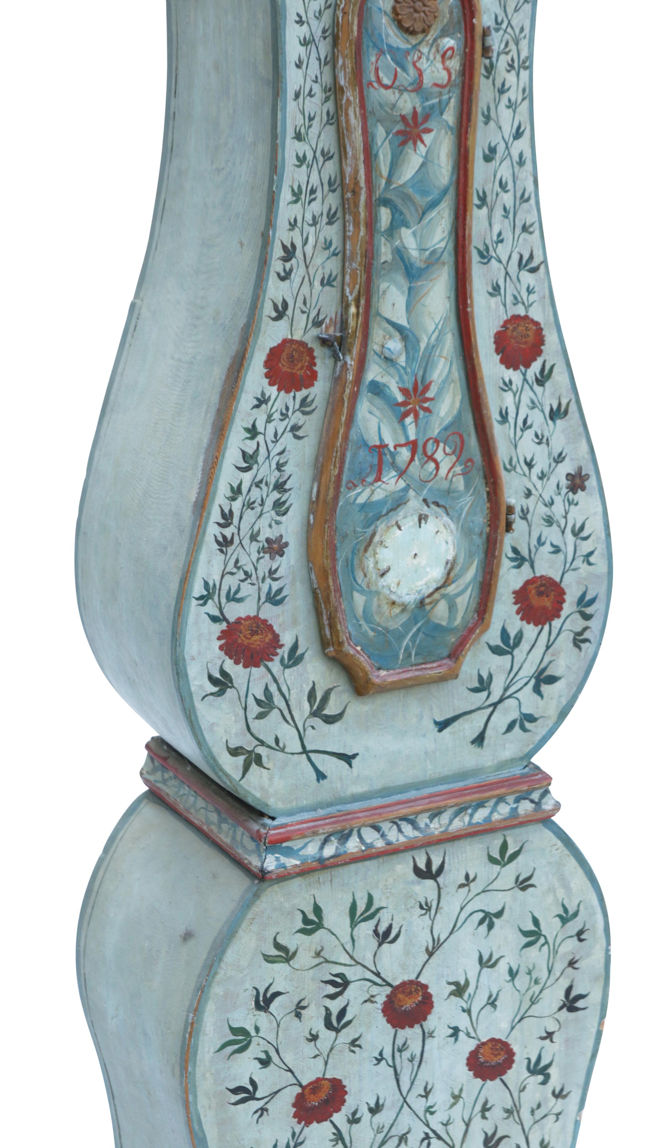 Antique Swedish Mora clock in blue with hand painted floral details and the date of the clock 1782 painted on the body. Working Longcase clock mechanism of pendulum and 2 weights and a bell chime on the hour.

Width: 42cm / 16.5