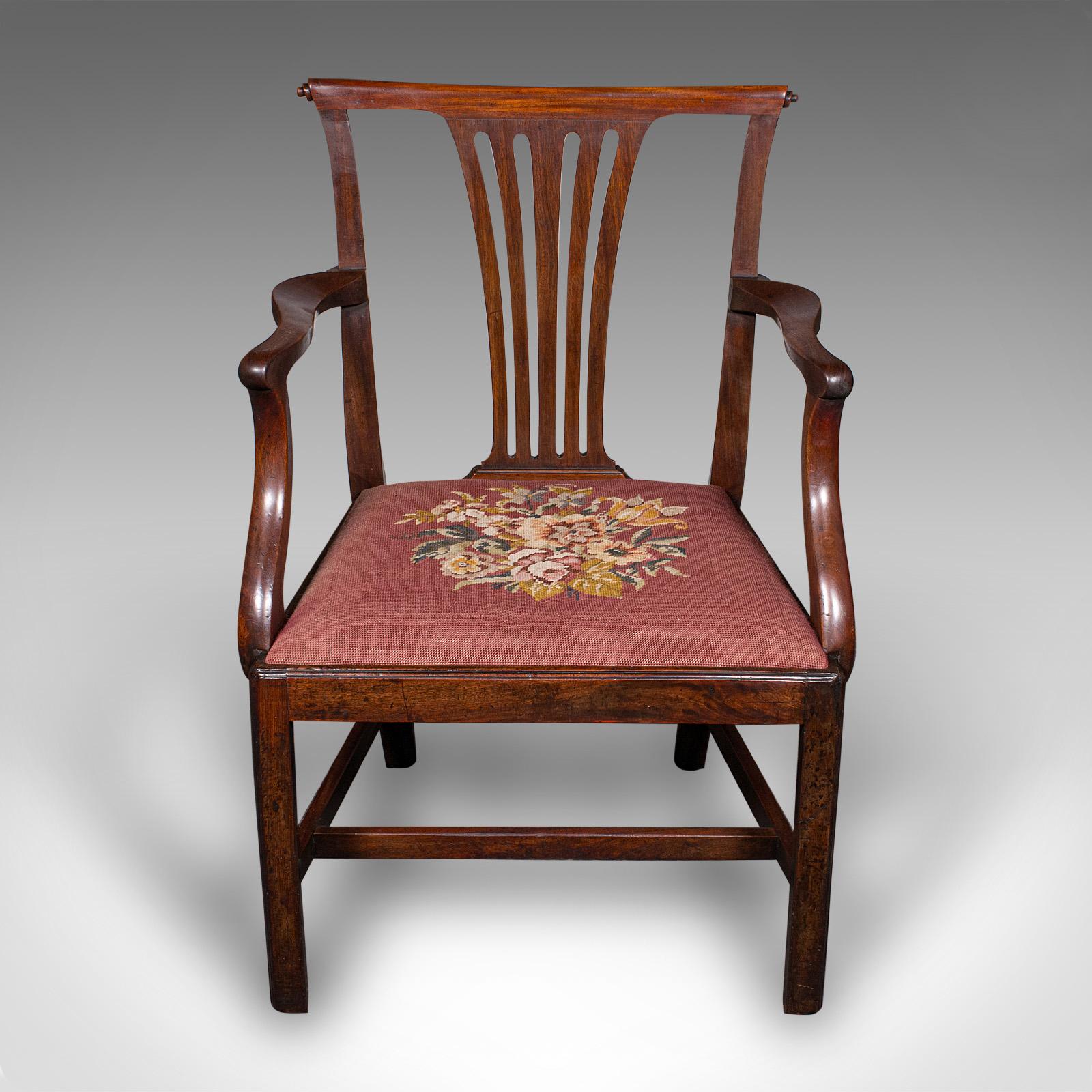 
This is an antique morning room elbow chair. An English, mahogany armchair in Chippendale taste, dating to the Georgian period, circa 1770.

Endearing Chippendale taste with generous width and fine craftsmanship
Displaying a desirable aged patina
