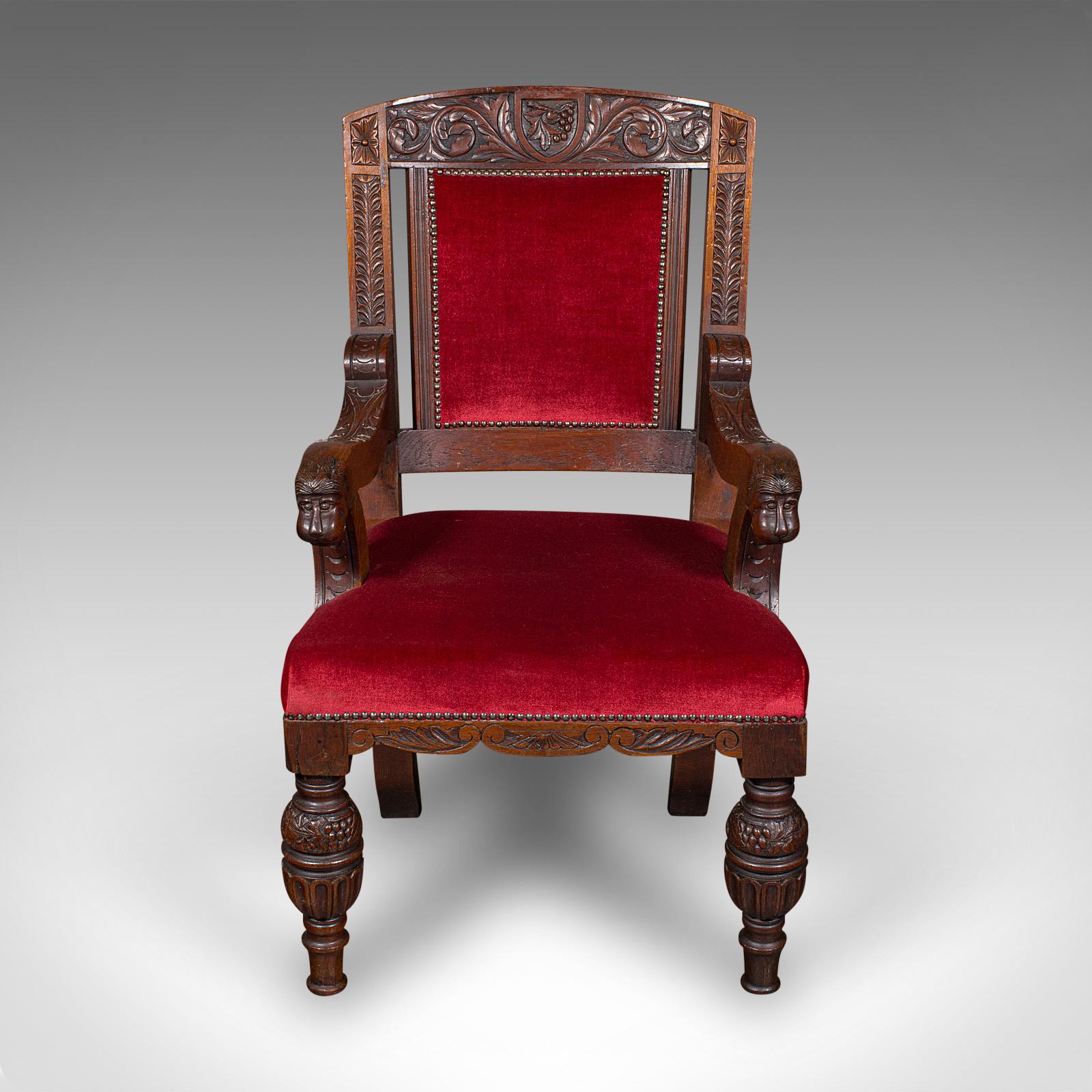 This is an antique morning room elbow chair. A Scottish, carved oak throne seat in Gothic revival taste, dating to the Victorian period, circa 1880.

Broad and generous form to this country house chair
Displays a desirable aged patina and in good