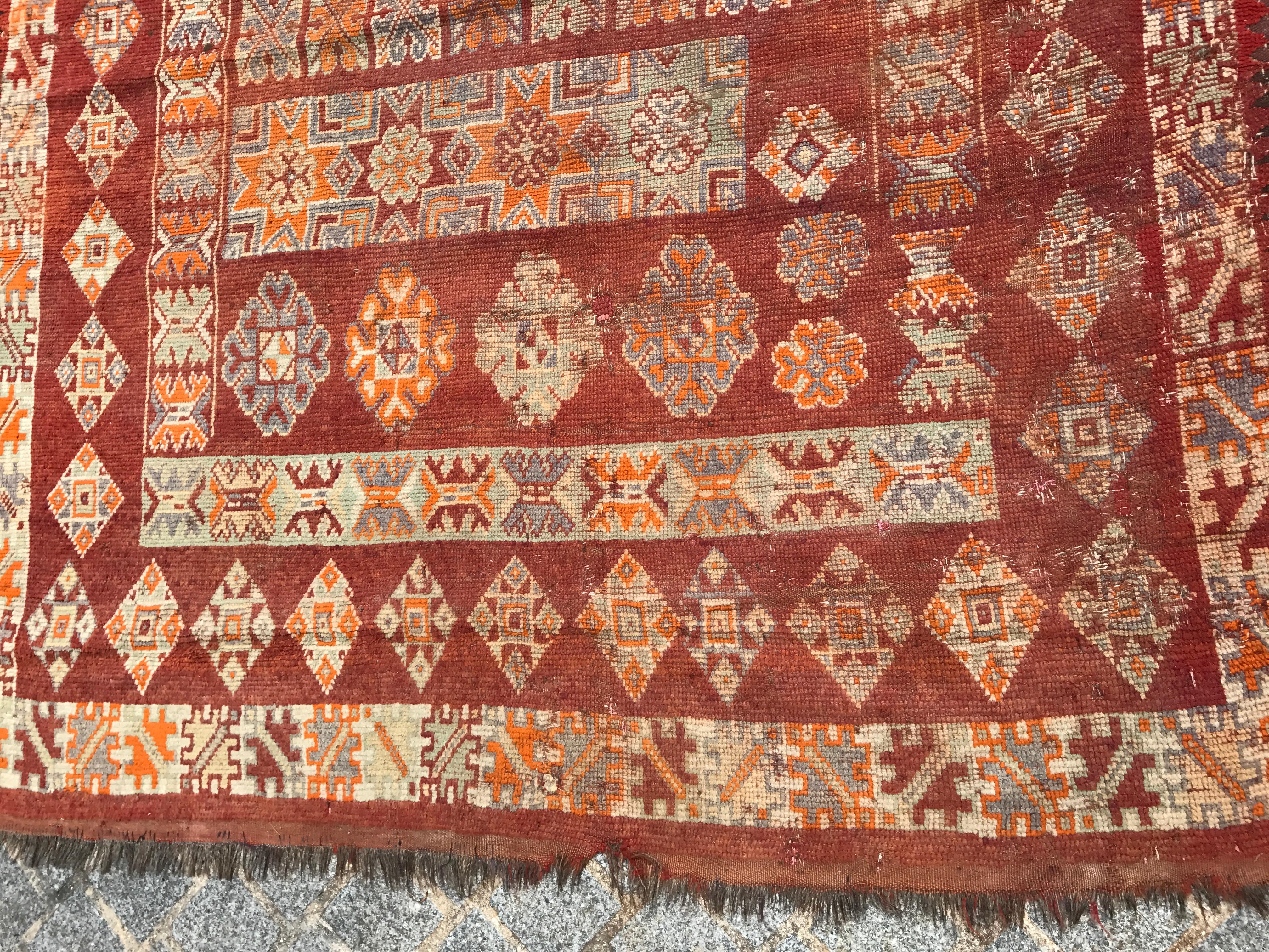 Nice early 20th century Moroccan long rug with beautiful geometrical design and red brown, orange and purple colors, entirely hand knotted with wool velvet on wool foundation.


 