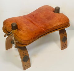 Antique Moroccan Camel Saddle Leather Footstool with Bronze Bell