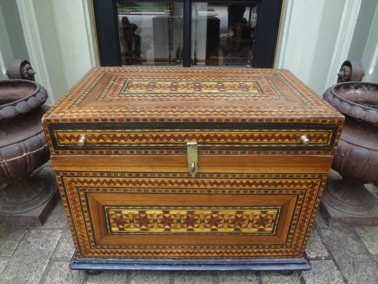 Antique Moroccan coffer, trunk or box. This Stunning Large Moroccan box is inlaid with a variety of woods including an interior storage compartment with felt lining.
This large decorative box, document box, coffer, trunk or chest is a versatile