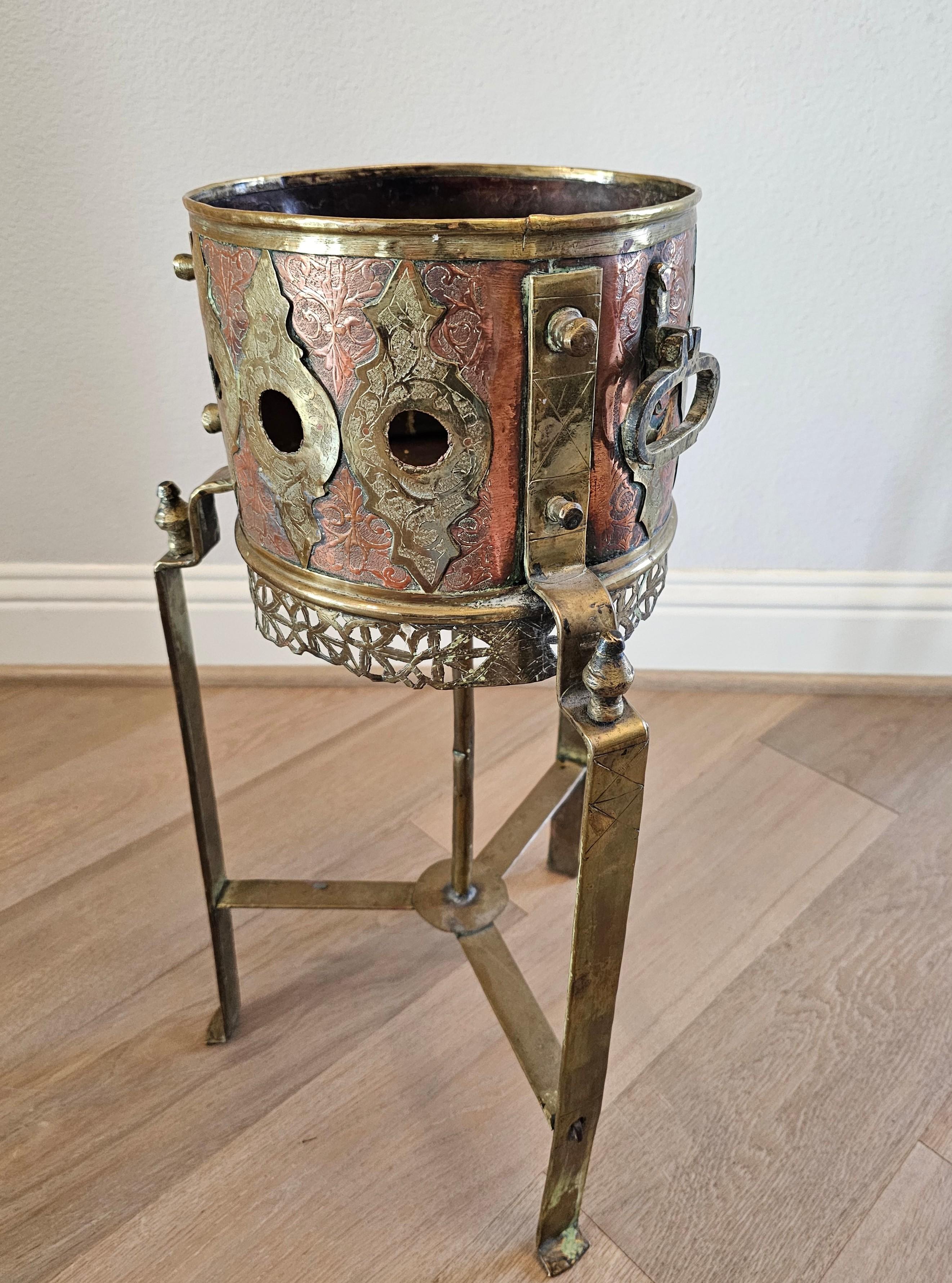 A rare, unusual, and highly decorative antique Moroccan brass, copper and bronze kettle warming stand - brazier (today it would make for fascinating candle or plant stand, fireplace kindling holder, wine cooler ice bucket stand, glass top table or