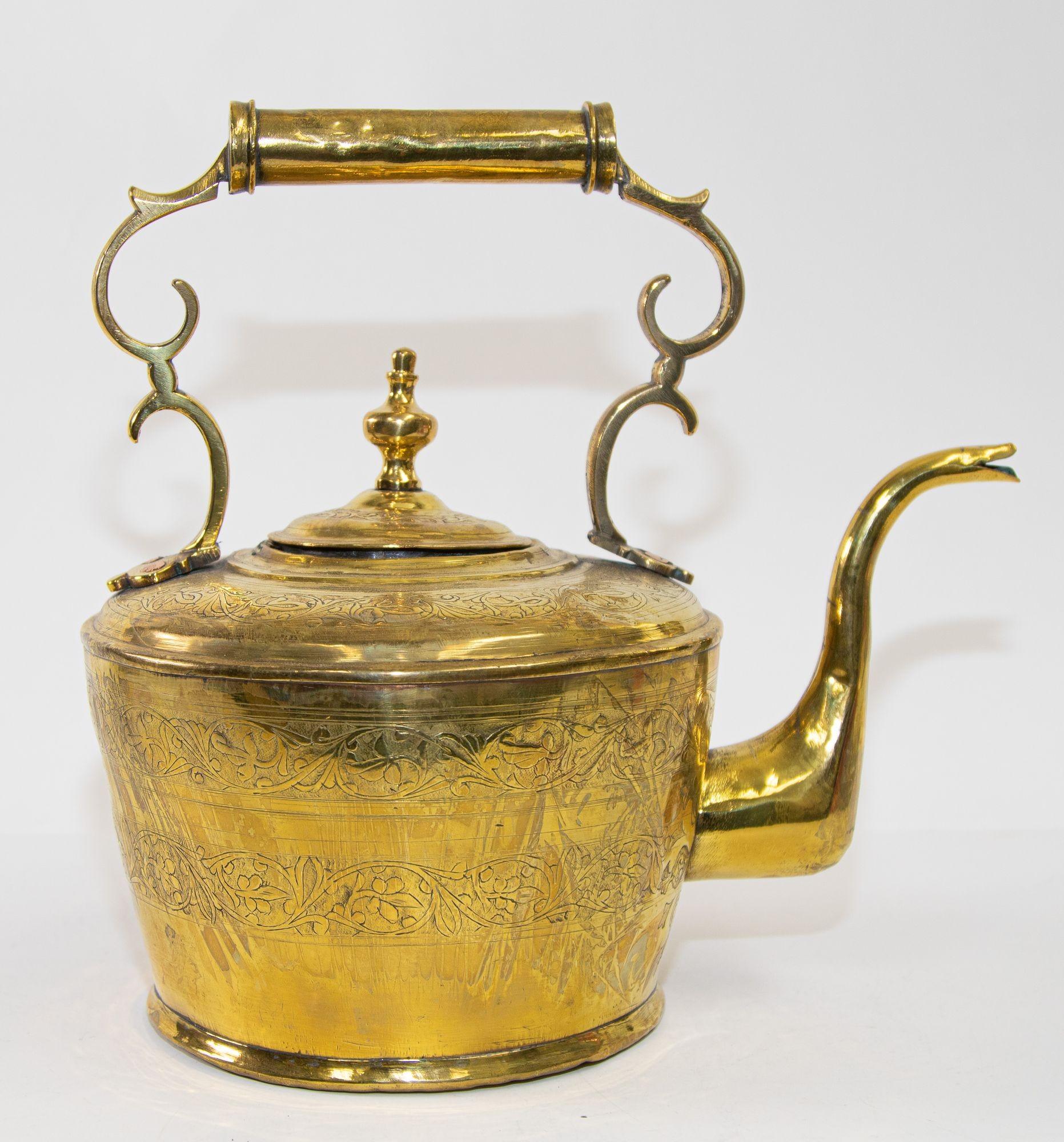 Antique Moroccan Moorish large heavy solid brass kettle embossed with brass floral design.
It is a unique piece to display in your kitchen or to add to your brass collection.
Moroccan brass tea kettle pot, museum quality, one of a kind finely and