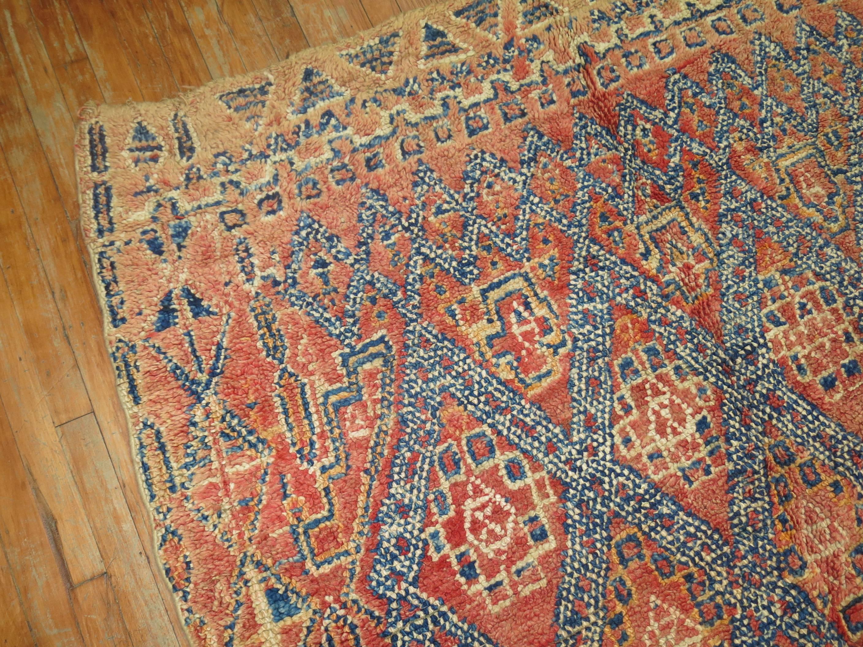 An authentic early 20th century one of a kind Moroccan rug.