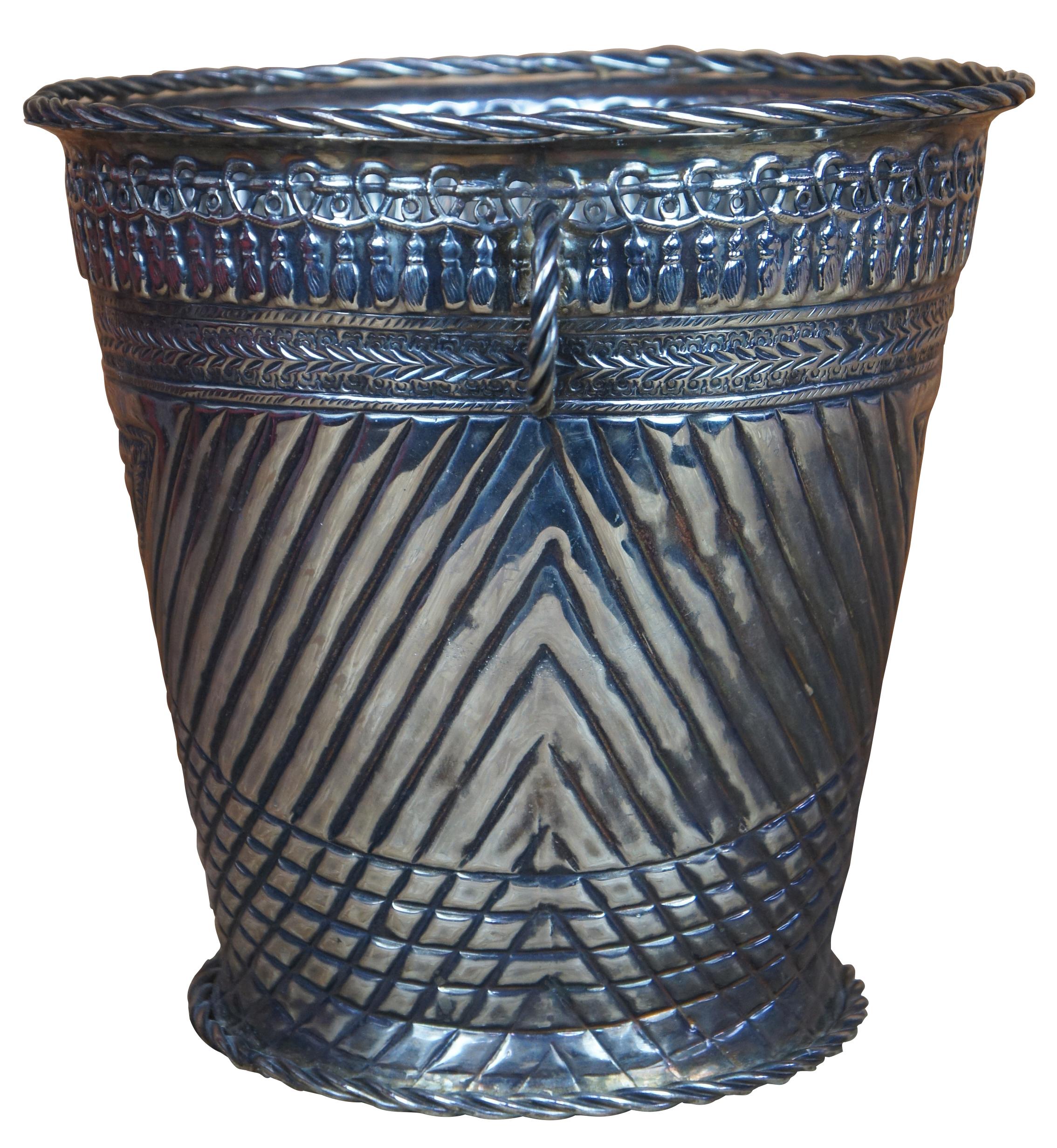 Antique Moroccan silver Hammam bucket featuring hammered, twisted, and reticulated / pierced geometric designs. These buckets were traditionally used for pouring water in Moroccan Hammam baths. Each bucket has traditional Moroccan patterns hammered