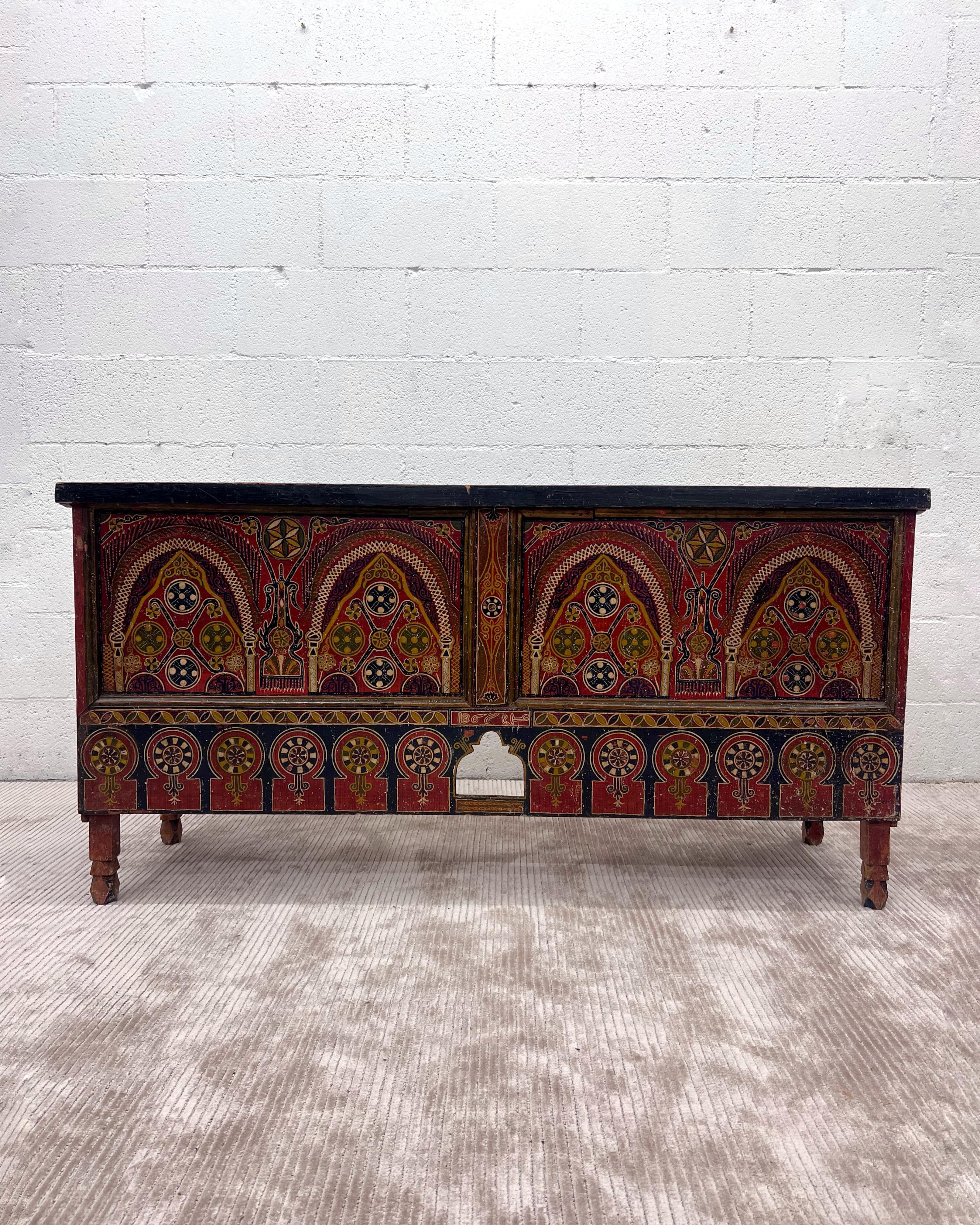 Antique hand painted Moroccan trunk. A deep textured patina that only time can create. 
Great for in an entryway, or in a living room, or at the end of the bed to store blankets. 

Handed painted on two side front and right side, the left side is