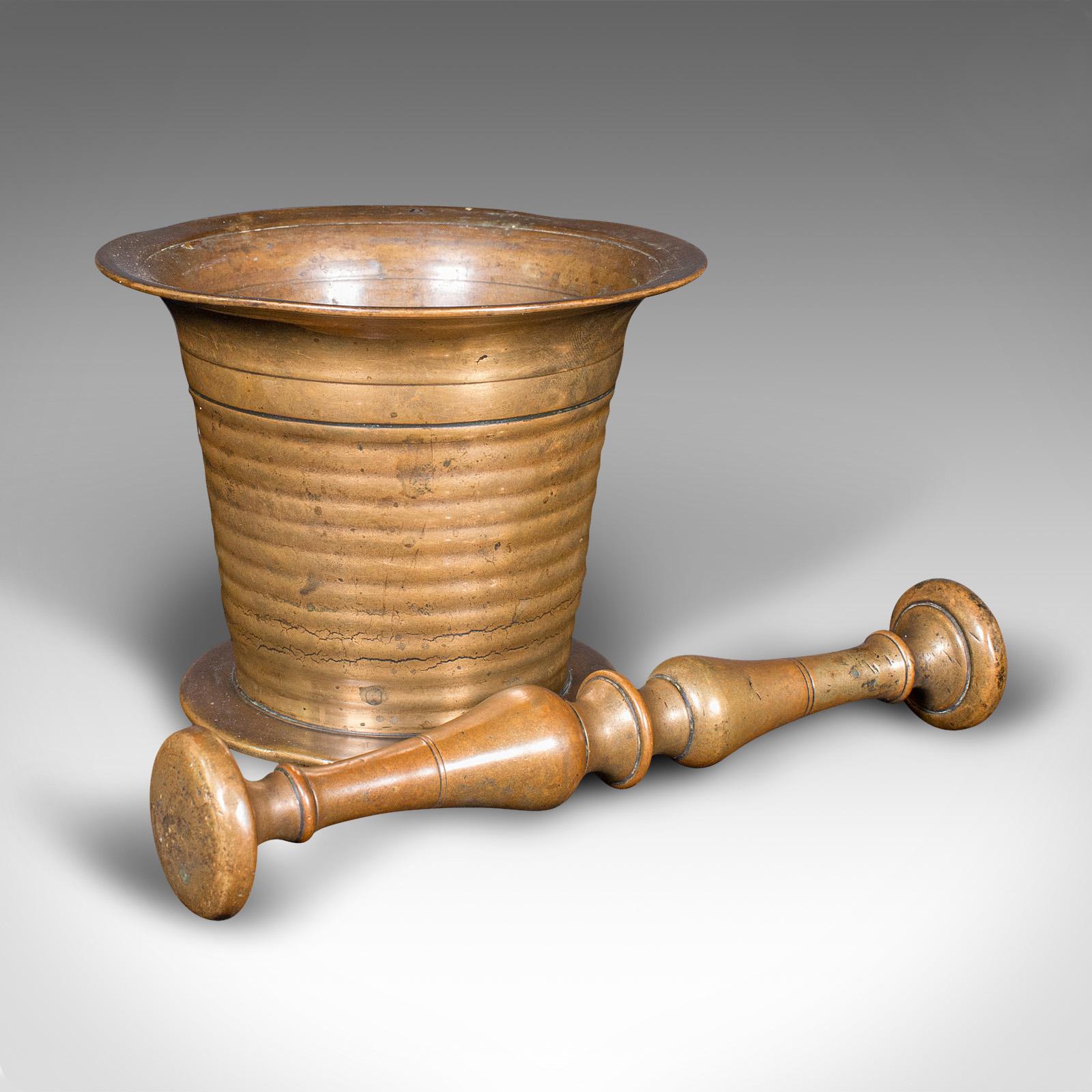 
This is an antique mortar and pestle. An English, brass apothecary instrument, dating to the Victorian period, circa 1850.

Appealing Victorian mortar and pestle with a tactile finish
Displaying a desirable aged patina and in good order
Brass