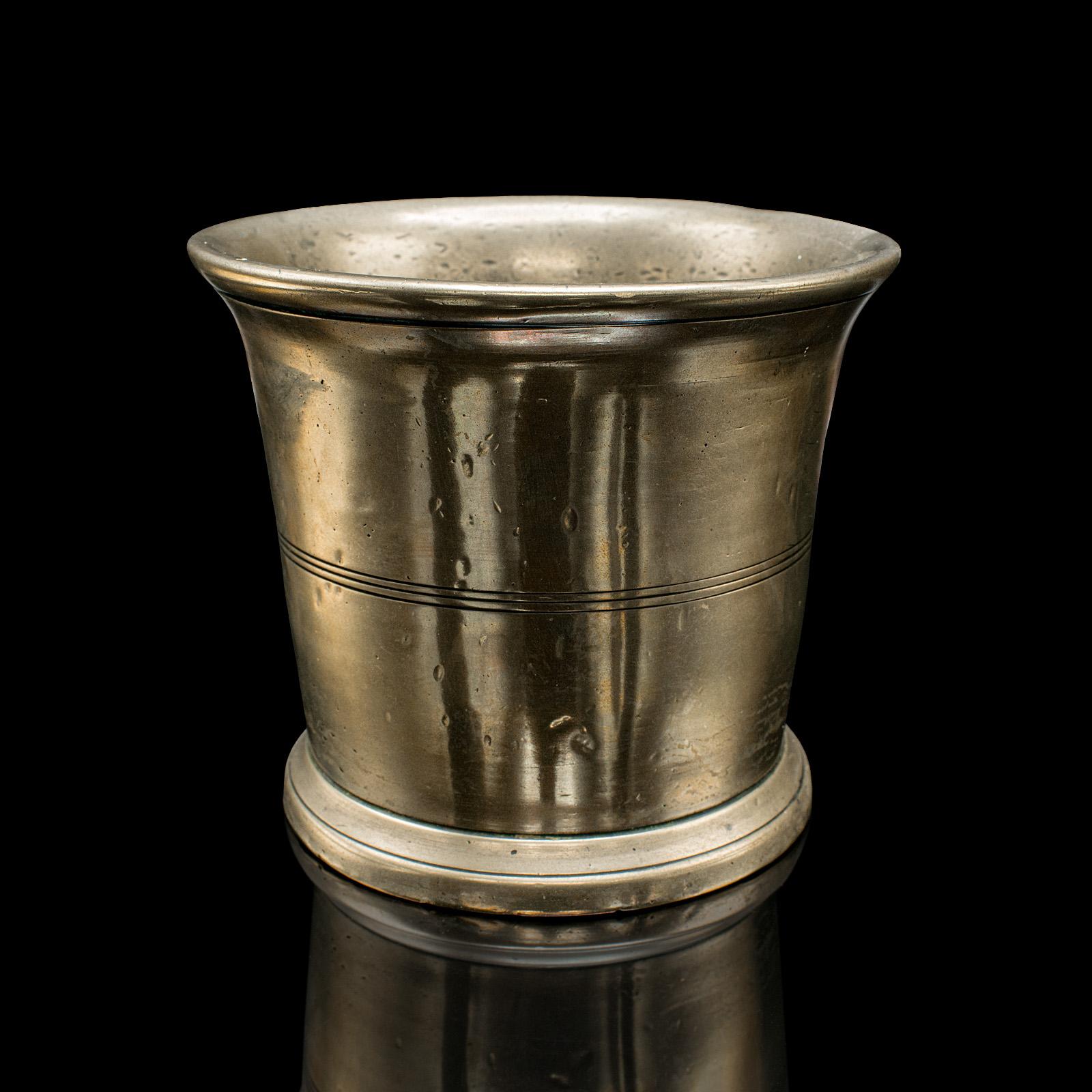 This is an antique mortar and pestle set. An English, bronze apothecary or chemist’s grinding aid, dating to the mid Georgian period, circa 1750. A fascinating early example, rich with period character and appealing surface detail.

Charming