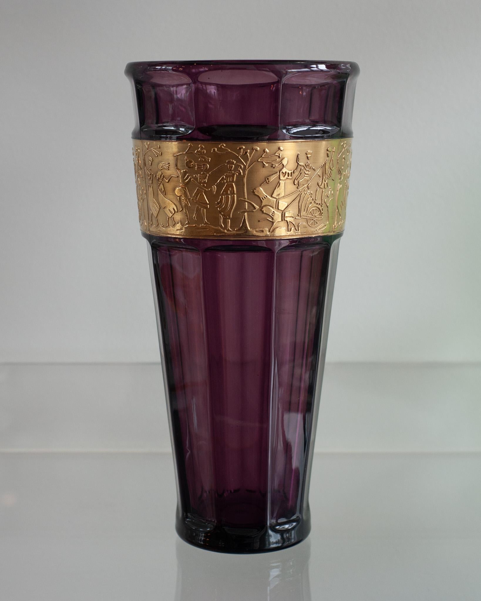 A beautiful Moser amethyst vase with gold gilded frieze. Hand blown purple crystal with a wide band of gold around the body, decorated with a cameo cut scene with antique roman figures. A classic and timeless Moser style.