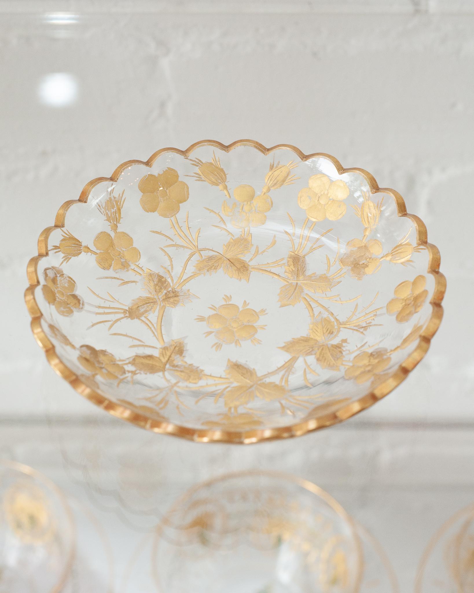 An ornately etched and gilded antique Moser crystal bowl with scalloped edge. A fine example of top quality craftsmanship from the turn of the century. Perfect for decorative or serving use.