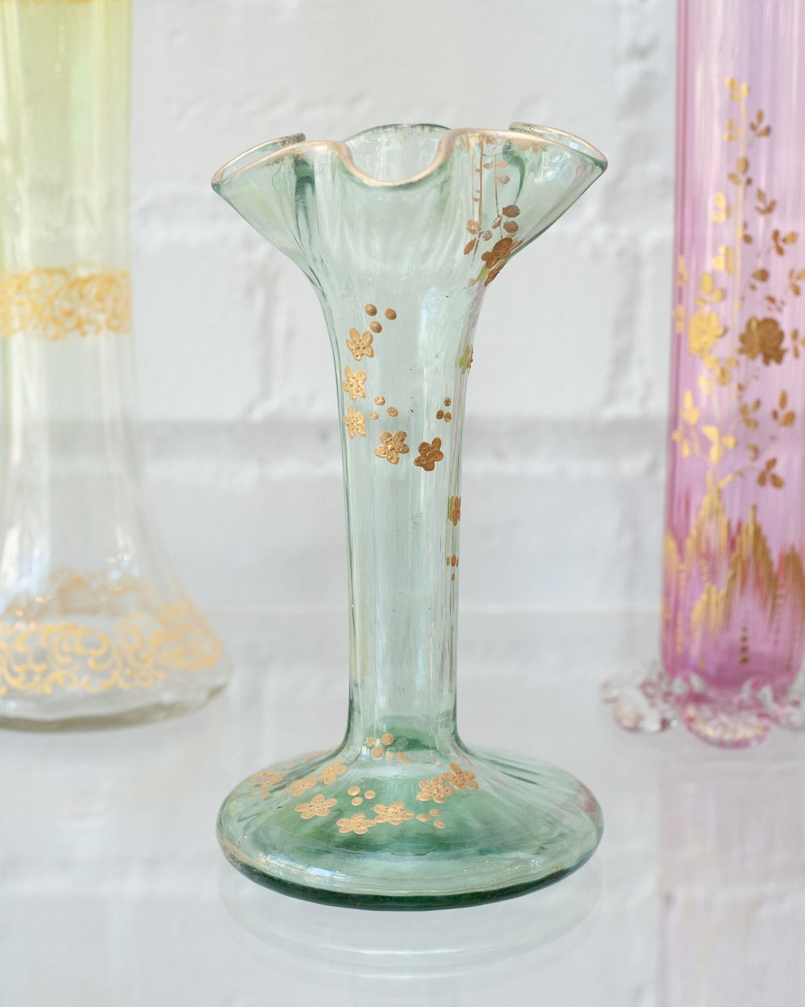 A beautiful antique Moser flared vase, with gold floral gilded details. Beautifully made and in excellent condition for its age. A beautiful example of turn of the century Bohemian craftsmanship.