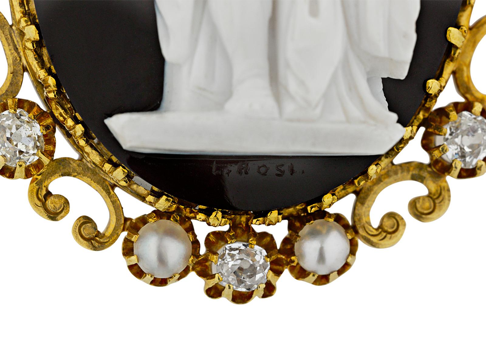 The legendary Michelangelo's Moses is meticulously recreated in this 19th-century cameo brooch. Crafted of beautiful onyx, the intricate cameo resides in its 18K yellow gold mounting surrounded by eight Old Mine cut diamonds and eight natural white