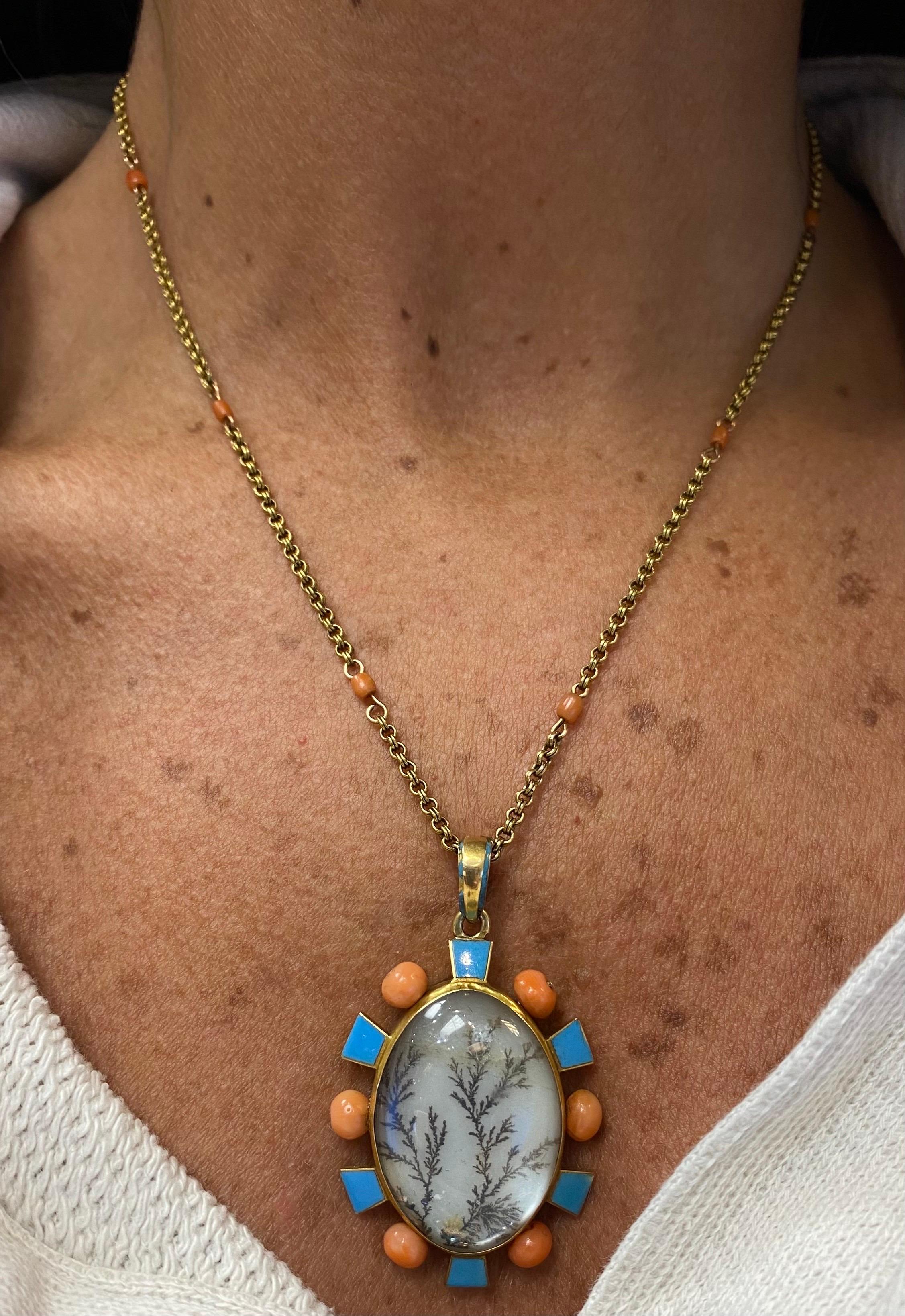 Antique Moss Agate and Coral Pendant Necklace

A moss agate pendant necklace adorned with blue enamel and 6 coral beads. The gold chain features an additional 8 coral beads

Made circa 1860

Approximate Chain Measurements: 16