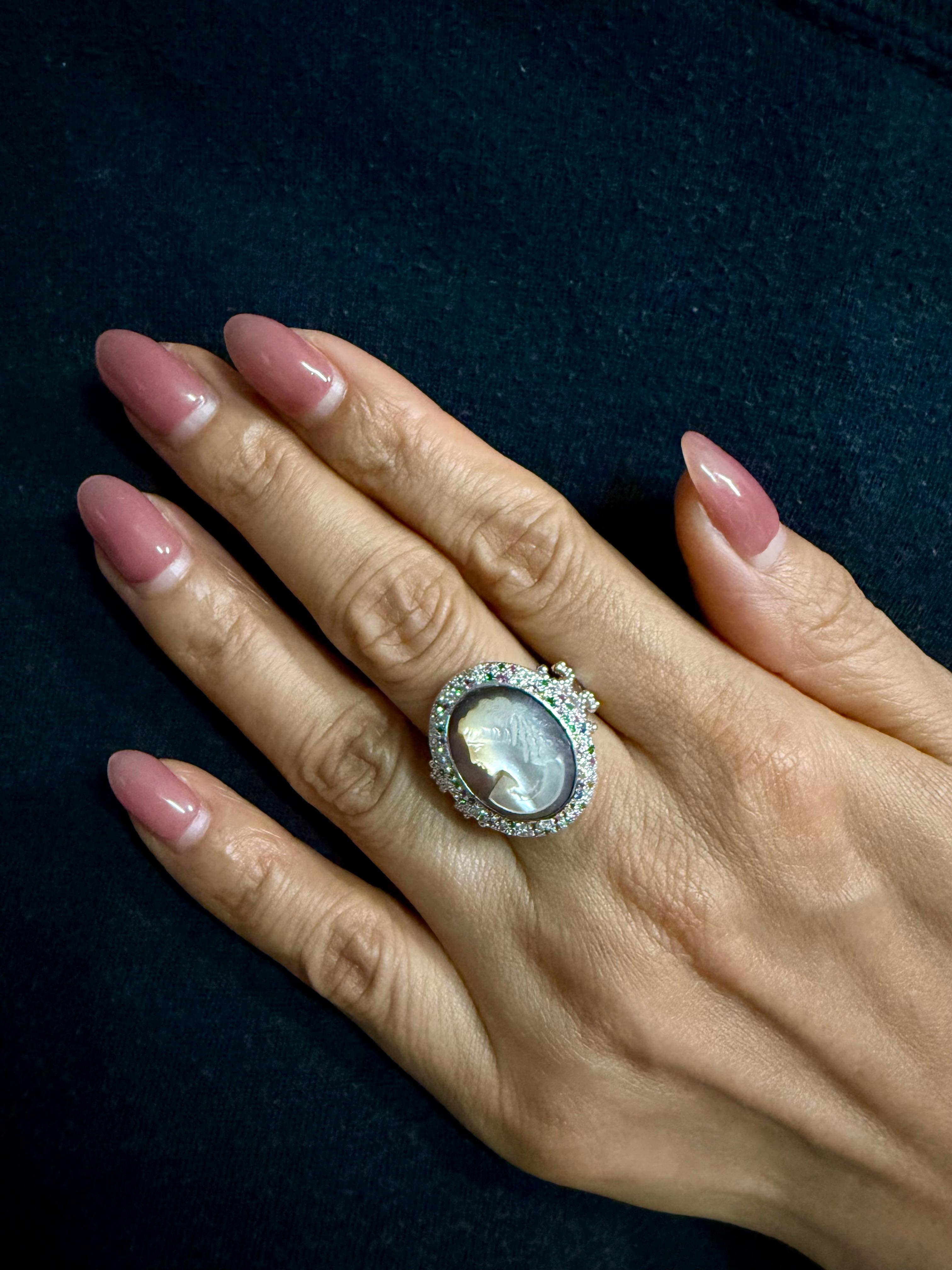 Please check out the HD Video. The center mother of pearl Cameo is antique (over 100 years old), the ring setting is newly made. The color combination is out of this world! This superb cameo has masterful high relief carving! It has such a realistic