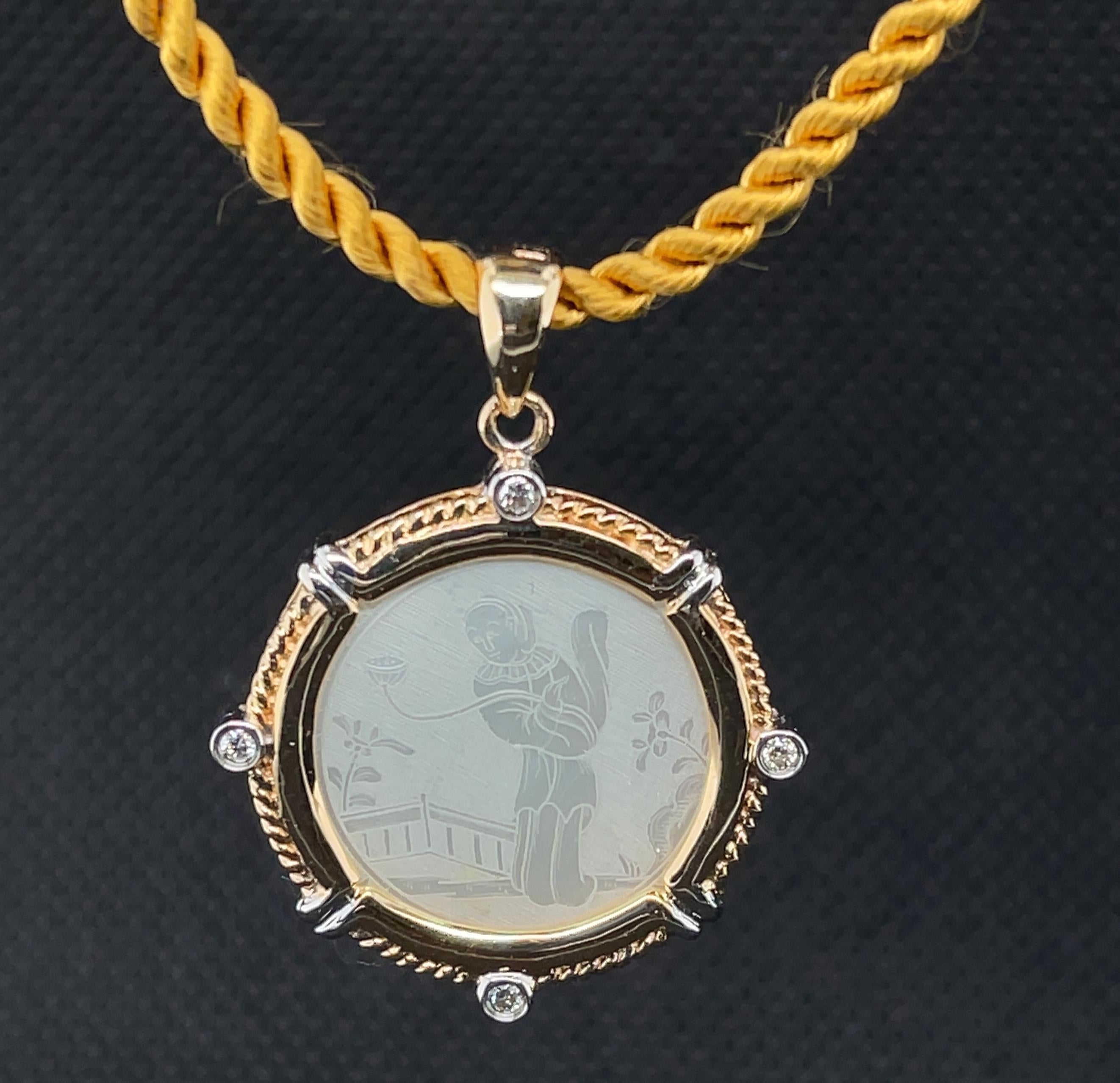 This pretty necklace features a fine-quality, antique mother-of-pearl gambling counter set in 14k yellow gold with diamonds. Gaming counters or 
