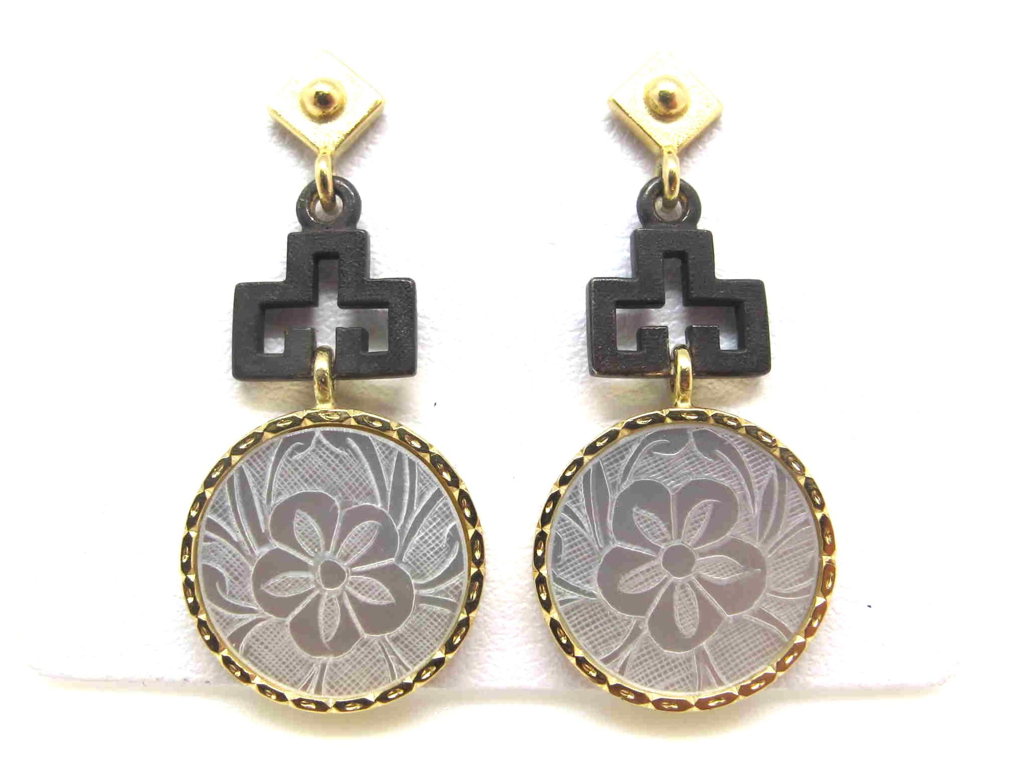 These earrings feature antique, mother-of-pearl Chinese gambling counters with motifs dating back to the 18th Century. They are original pieces that we have made in to jewelry. Originally carved in China for export to Britain, they were used like we