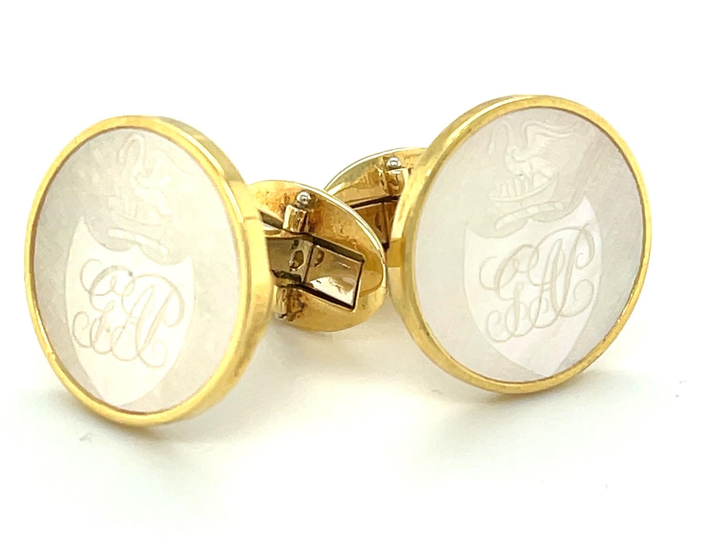 These handsome mother-of-pearl and 18k yellow gold cufflinks feature a gorgeous matching pair of antique gaming counters that were hand-engraved in the 1800's. Originally carved in China and used by the British the way we use poker chips, these