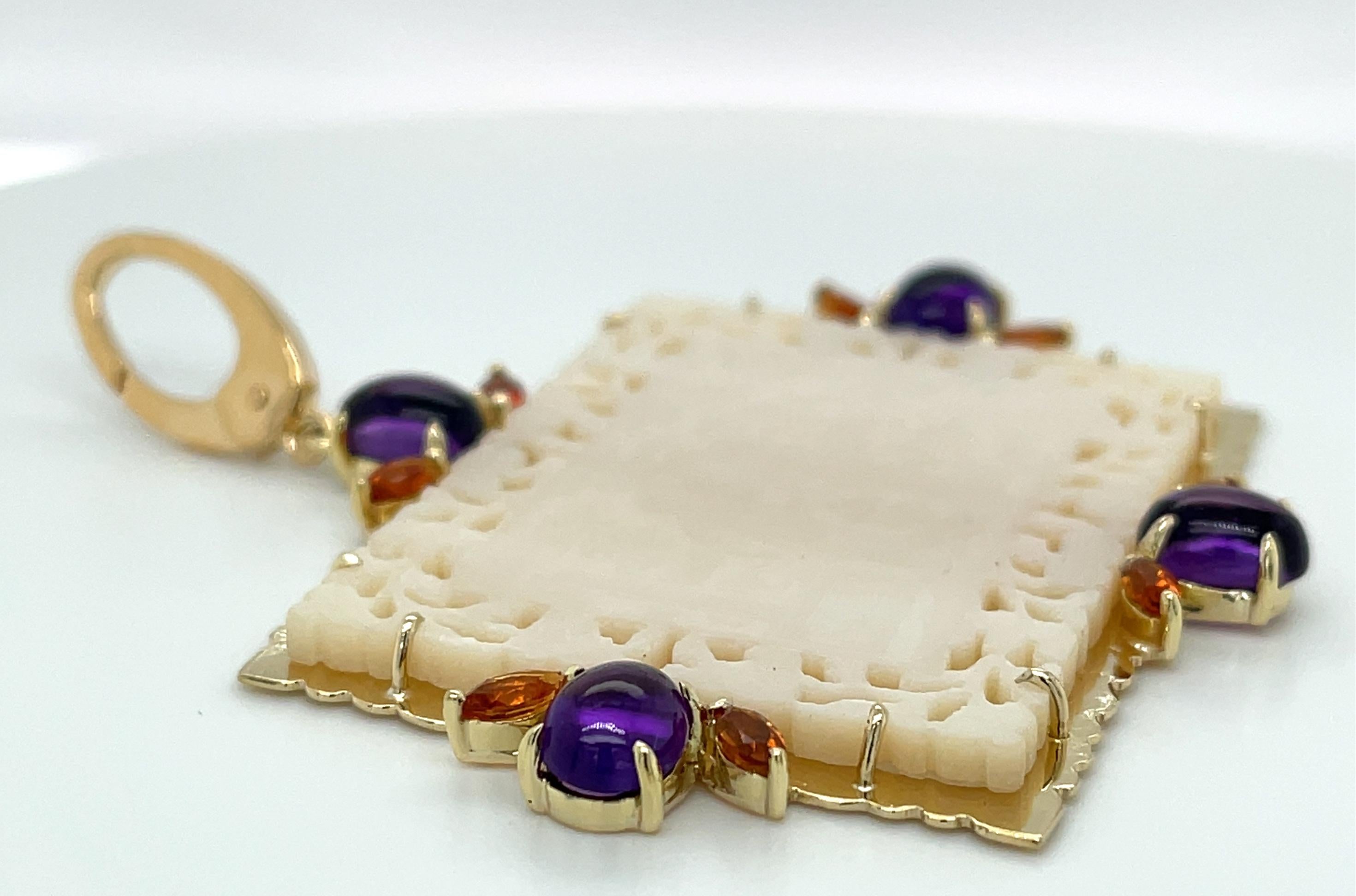 This stunning pendant features a beautifully fretted antique mother-of-pearl gambling counter set in precious 18k yellow gold with rich purple amethyst cabochons and brilliant Madeira colored citrines. Gambling counters, or gaming chips as they were